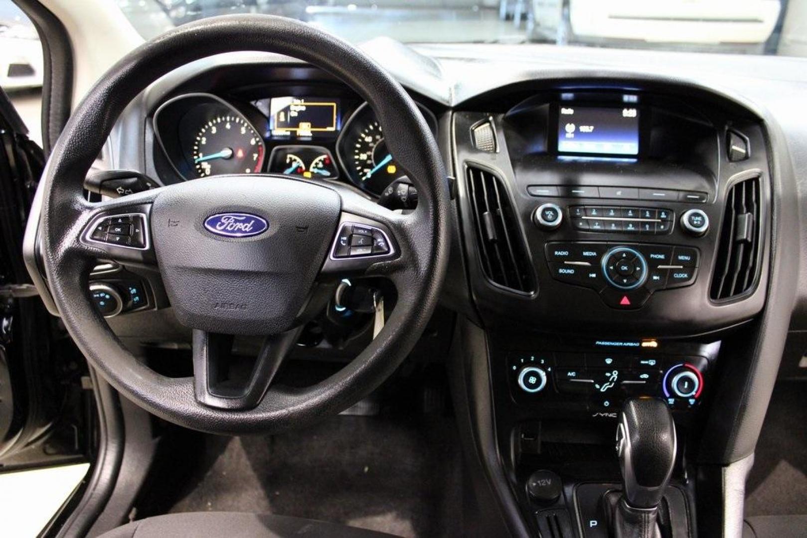 2018 Shadow Black /Charcoal Black Ford Focus S (1FADP3E20JL) with an 2.0L I4 DGI Ti-VCT engine, Automatic transmission, located at 15300 Midway Rd., Addison, TX, 75001, (972) 702-0011, 32.958321, -96.838074 - 2018 Ford Focus S<br>Now Available at Midway Auto Group Addison, Texas<br><br>Efficient, reliable, and fun to drivethe 2018 Ford Focus S is a compact sedan that offers outstanding value for daily commuters, first-time buyers, or anyone looking for practical, affordable transportation. With its nimb - Photo#16