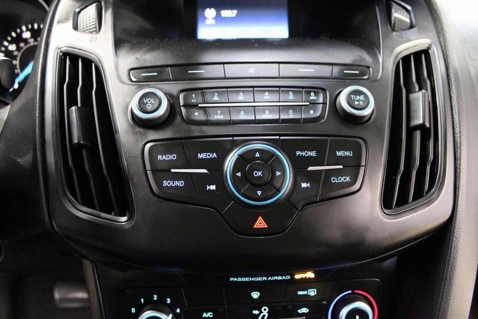 2018 Shadow Black /Charcoal Black Ford Focus S (1FADP3E20JL) with an 2.0L I4 DGI Ti-VCT engine, Automatic transmission, located at 15300 Midway Rd., Addison, TX, 75001, (972) 702-0011, 32.958321, -96.838074 - 2018 Ford Focus S<br>Now Available at Midway Auto Group Addison, Texas<br><br>Efficient, reliable, and fun to drivethe 2018 Ford Focus S is a compact sedan that offers outstanding value for daily commuters, first-time buyers, or anyone looking for practical, affordable transportation. With its nimb - Photo#19