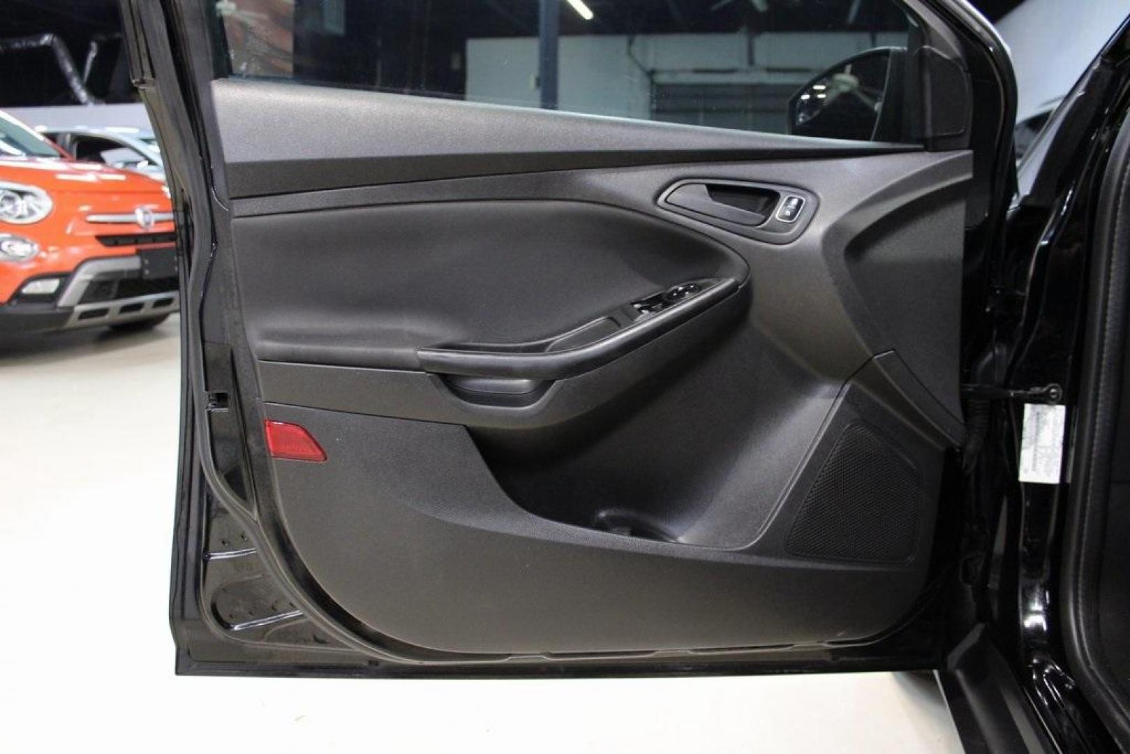 2018 Shadow Black /Charcoal Black Ford Focus S (1FADP3E20JL) with an 2.0L I4 DGI Ti-VCT engine, Automatic transmission, located at 15300 Midway Rd., Addison, TX, 75001, (972) 702-0011, 32.958321, -96.838074 - 2018 Ford Focus S<br>Now Available at Midway Auto Group Addison, Texas<br><br>Efficient, reliable, and fun to drivethe 2018 Ford Focus S is a compact sedan that offers outstanding value for daily commuters, first-time buyers, or anyone looking for practical, affordable transportation. With its nimb - Photo#24