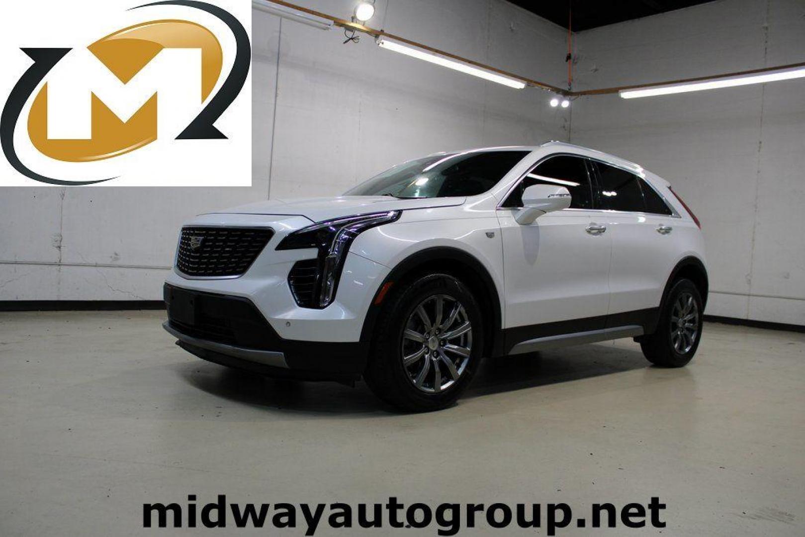 2021 Crystal White Tricoat /Black Cadillac XT4 Premium Luxury (1GYFZCR48MF) with an 2.0L I4 Turbocharged engine, Automatic transmission, located at 15300 Midway Rd., Addison, TX, 75001, (972) 702-0011, 32.958321, -96.838074 - 2021 Cadillac XT4 Premium Luxury<br>Now Available at Midway Auto Group Addison, Texas<br><br>Elevate your everyday drive with the 2021 Cadillac XT4 Premium Luxury a compact luxury SUV that blends bold styling, advanced technology, and premium comfort. With responsive performance and a refined inter - Photo#0
