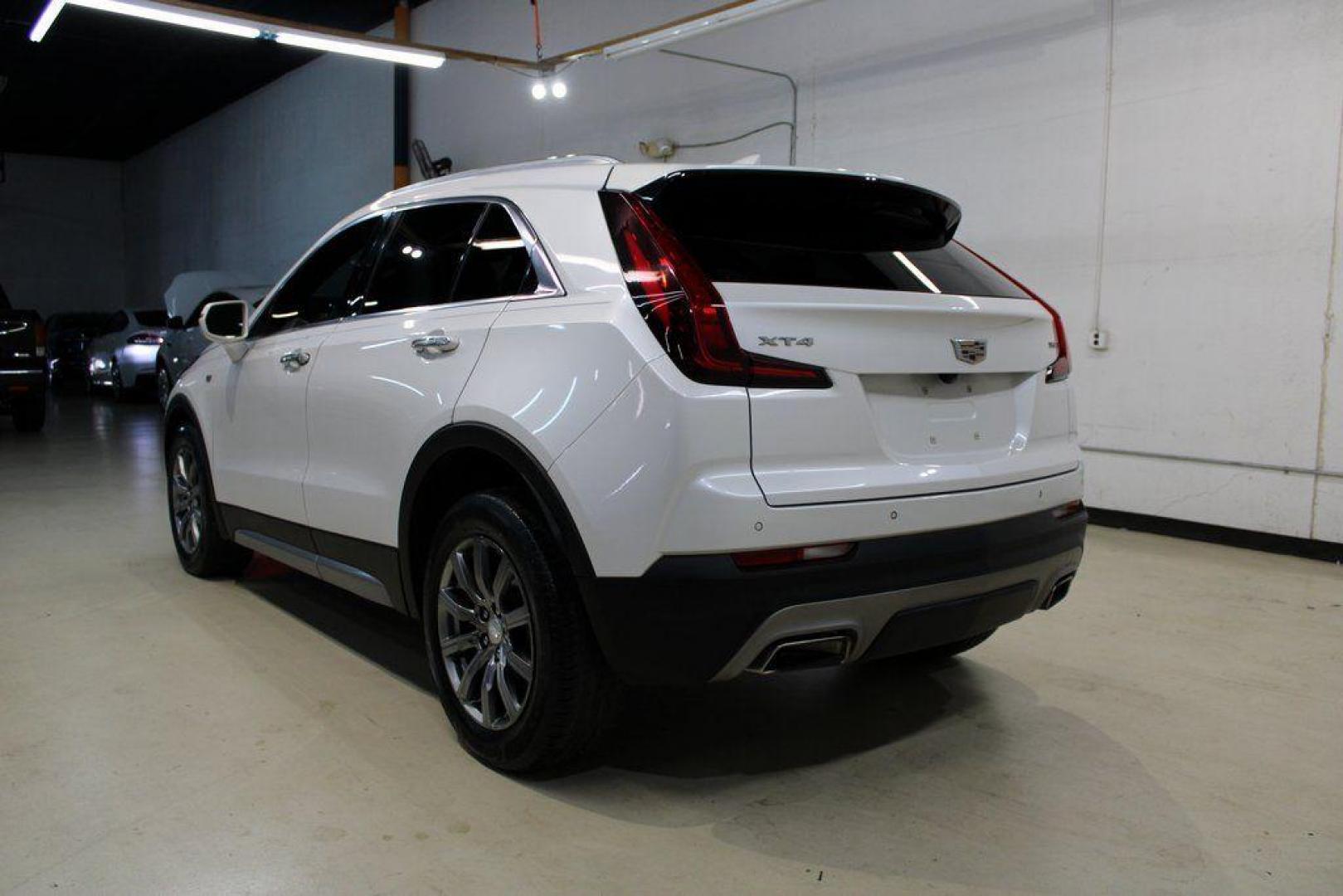 2021 Crystal White Tricoat /Black Cadillac XT4 Premium Luxury (1GYFZCR48MF) with an 2.0L I4 Turbocharged engine, Automatic transmission, located at 15300 Midway Rd., Addison, TX, 75001, (972) 702-0011, 32.958321, -96.838074 - 2021 Cadillac XT4 Premium Luxury<br>Now Available at Midway Auto Group Addison, Texas<br><br>Elevate your everyday drive with the 2021 Cadillac XT4 Premium Luxury a compact luxury SUV that blends bold styling, advanced technology, and premium comfort. With responsive performance and a refined inter - Photo#3