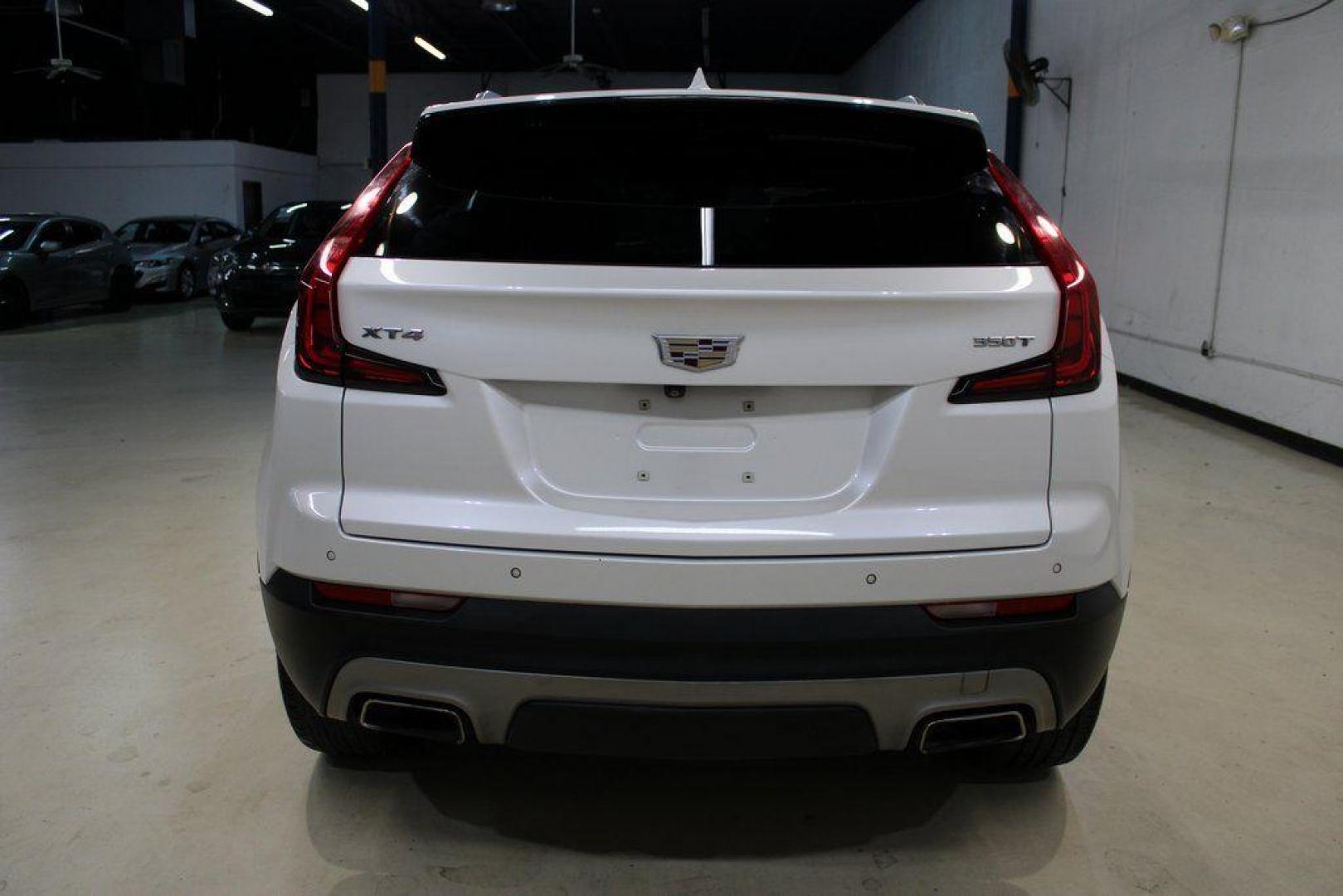 2021 Crystal White Tricoat /Black Cadillac XT4 Premium Luxury (1GYFZCR48MF) with an 2.0L I4 Turbocharged engine, Automatic transmission, located at 15300 Midway Rd., Addison, TX, 75001, (972) 702-0011, 32.958321, -96.838074 - 2021 Cadillac XT4 Premium Luxury<br>Now Available at Midway Auto Group Addison, Texas<br><br>Elevate your everyday drive with the 2021 Cadillac XT4 Premium Luxury a compact luxury SUV that blends bold styling, advanced technology, and premium comfort. With responsive performance and a refined inter - Photo#5