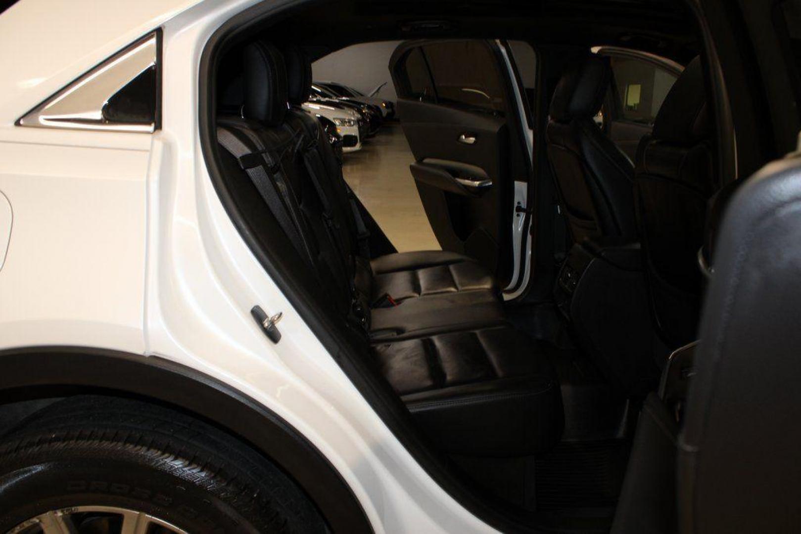 2021 Crystal White Tricoat /Black Cadillac XT4 Premium Luxury (1GYFZCR48MF) with an 2.0L I4 Turbocharged engine, Automatic transmission, located at 15300 Midway Rd., Addison, TX, 75001, (972) 702-0011, 32.958321, -96.838074 - 2021 Cadillac XT4 Premium Luxury<br>Now Available at Midway Auto Group Addison, Texas<br><br>Elevate your everyday drive with the 2021 Cadillac XT4 Premium Luxury a compact luxury SUV that blends bold styling, advanced technology, and premium comfort. With responsive performance and a refined inter - Photo#12