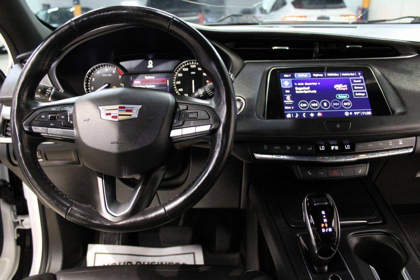 2021 Crystal White Tricoat /Black Cadillac XT4 Premium Luxury (1GYFZCR48MF) with an 2.0L I4 Turbocharged engine, Automatic transmission, located at 15300 Midway Rd., Addison, TX, 75001, (972) 702-0011, 32.958321, -96.838074 - 2021 Cadillac XT4 Premium Luxury<br>Now Available at Midway Auto Group Addison, Texas<br><br>Elevate your everyday drive with the 2021 Cadillac XT4 Premium Luxury a compact luxury SUV that blends bold styling, advanced technology, and premium comfort. With responsive performance and a refined inter - Photo#14