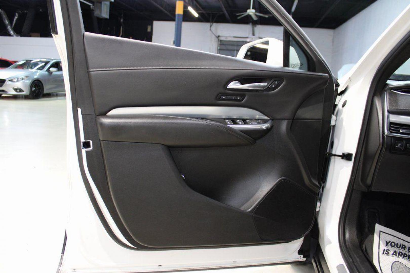 2021 Crystal White Tricoat /Black Cadillac XT4 Premium Luxury (1GYFZCR48MF) with an 2.0L I4 Turbocharged engine, Automatic transmission, located at 15300 Midway Rd., Addison, TX, 75001, (972) 702-0011, 32.958321, -96.838074 - 2021 Cadillac XT4 Premium Luxury<br>Now Available at Midway Auto Group Addison, Texas<br><br>Elevate your everyday drive with the 2021 Cadillac XT4 Premium Luxury a compact luxury SUV that blends bold styling, advanced technology, and premium comfort. With responsive performance and a refined inter - Photo#25