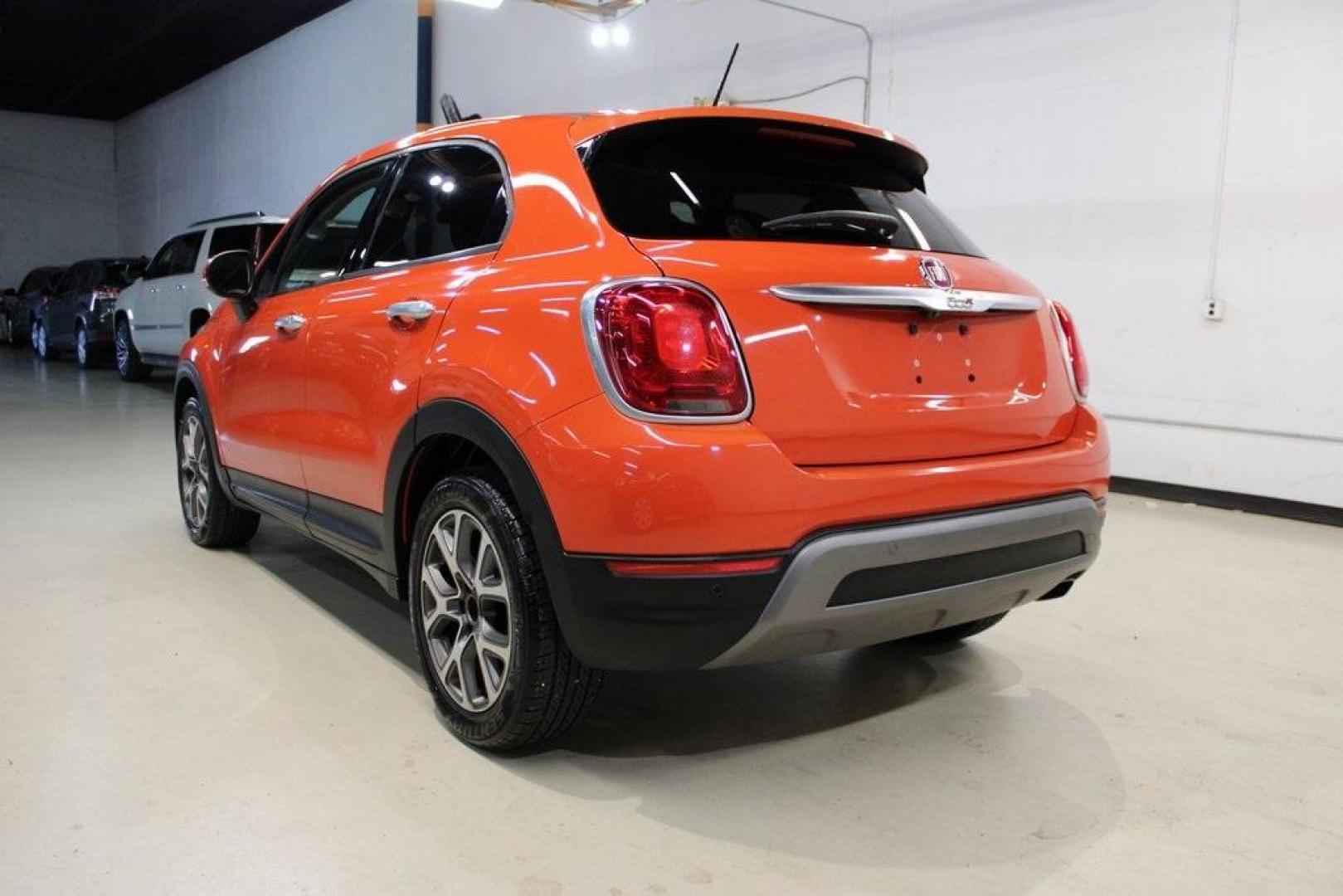 2016 Arancio (Orange) /Black Fiat 500X Trekking (ZFBCFXCT0GP) with an 2.4L I4 MultiAir engine, Automatic transmission, located at 15300 Midway Rd., Addison, TX, 75001, (972) 702-0011, 32.958321, -96.838074 - 2016 FIAT 500X Trekking<br>Now Available at Midway Auto Group Addison, Texas<br><br>Stylish, compact, and loaded with personality the 2016 FIAT 500X Trekking is an urban-friendly crossover with Italian flair and practical versatility. Whether you're navigating narrow city streets or heading out for - Photo#3