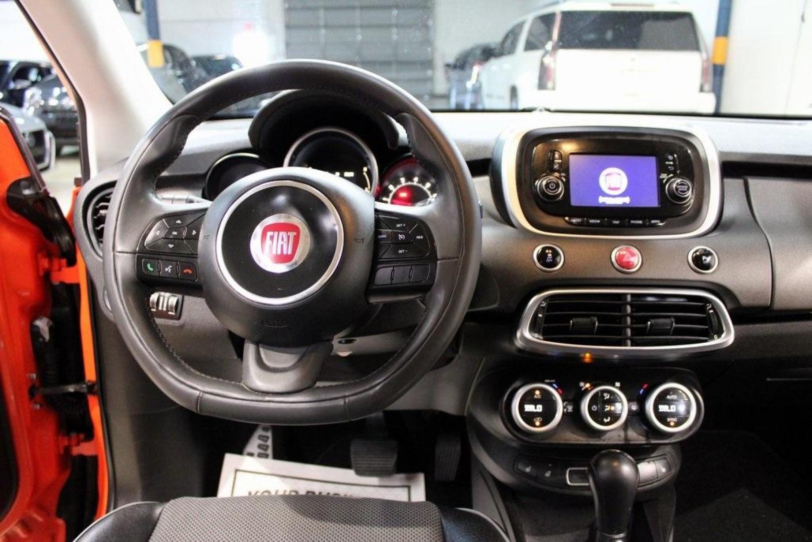 2016 Arancio (Orange) /Black Fiat 500X Trekking (ZFBCFXCT0GP) with an 2.4L I4 MultiAir engine, Automatic transmission, located at 15300 Midway Rd., Addison, TX, 75001, (972) 702-0011, 32.958321, -96.838074 - 2016 FIAT 500X Trekking<br>Now Available at Midway Auto Group Addison, Texas<br><br>Stylish, compact, and loaded with personality the 2016 FIAT 500X Trekking is an urban-friendly crossover with Italian flair and practical versatility. Whether you're navigating narrow city streets or heading out for - Photo#16