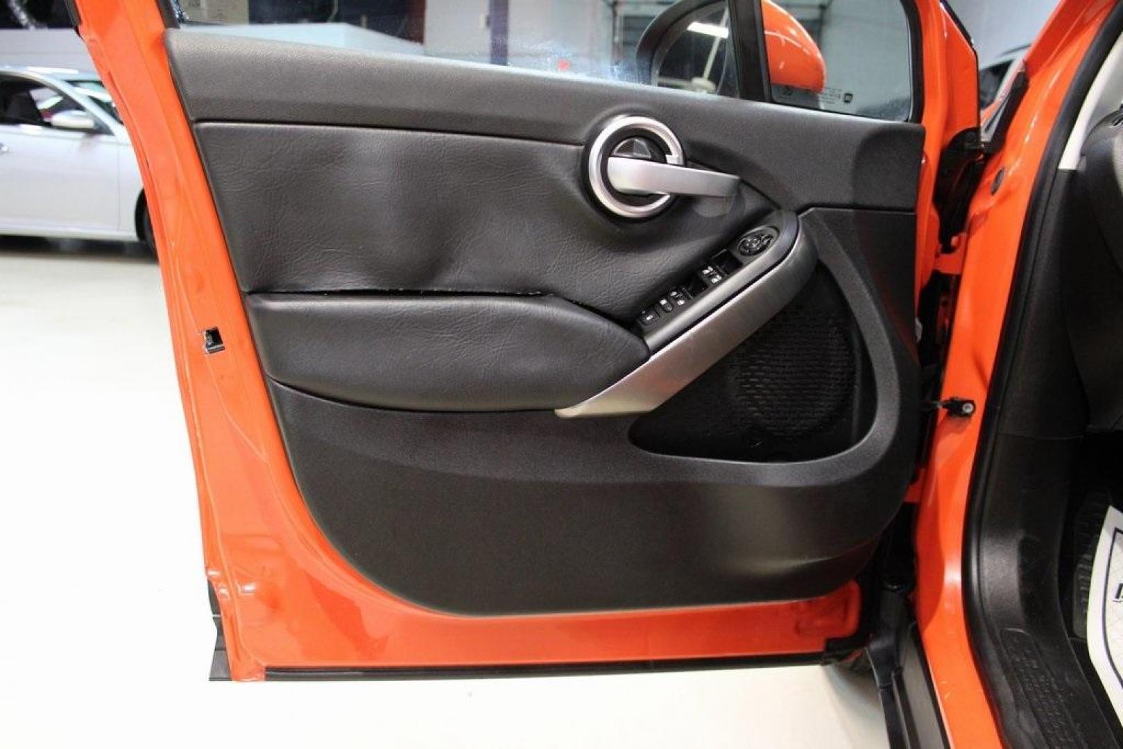 2016 Arancio (Orange) /Black Fiat 500X Trekking (ZFBCFXCT0GP) with an 2.4L I4 MultiAir engine, Automatic transmission, located at 15300 Midway Rd., Addison, TX, 75001, (972) 702-0011, 32.958321, -96.838074 - 2016 FIAT 500X Trekking<br>Now Available at Midway Auto Group Addison, Texas<br><br>Stylish, compact, and loaded with personality the 2016 FIAT 500X Trekking is an urban-friendly crossover with Italian flair and practical versatility. Whether you're navigating narrow city streets or heading out for - Photo#27
