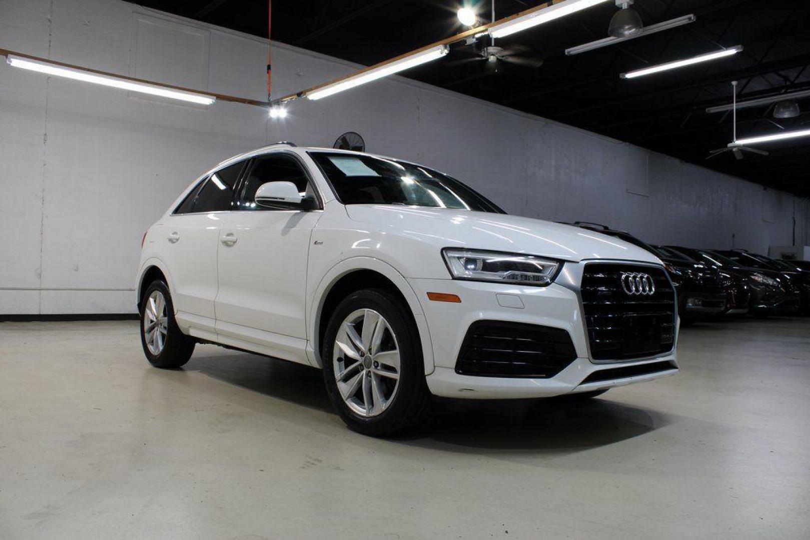 2018 White /Chestnut Brown Audi Q3 2.0T Premium (WA1JCCFS3JR) with an 2.0L 4-Cylinder TFSI engine, Automatic transmission, located at 15300 Midway Rd., Addison, TX, 75001, (972) 702-0011, 32.958321, -96.838074 - HOME OF THE NO HAGGLE PRICE - WHOLESALE PRICES TO THE PUBLIC!! Priced below KBB Fair Purchase Price!<br><br>White 2018 Audi Q3 2.0T Premium<br><br>20/28 City/Highway MPG<br><br>Awards:<br> * 2018 KBB.com 10 Best Luxury Cars Under $35,000 * 2018 KBB.com 10 Most Awarded Brands<br><br>At Midway Auto - Photo#1