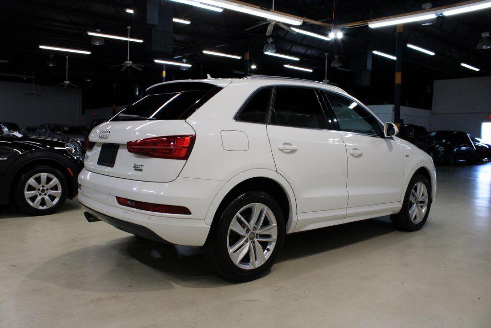 2018 White /Chestnut Brown Audi Q3 2.0T Premium (WA1JCCFS3JR) with an 2.0L 4-Cylinder TFSI engine, Automatic transmission, located at 15300 Midway Rd., Addison, TX, 75001, (972) 702-0011, 32.958321, -96.838074 - HOME OF THE NO HAGGLE PRICE - WHOLESALE PRICES TO THE PUBLIC!! Priced below KBB Fair Purchase Price!<br><br>White 2018 Audi Q3 2.0T Premium<br><br>20/28 City/Highway MPG<br><br>Awards:<br> * 2018 KBB.com 10 Best Luxury Cars Under $35,000 * 2018 KBB.com 10 Most Awarded Brands<br><br>At Midway Auto - Photo#2
