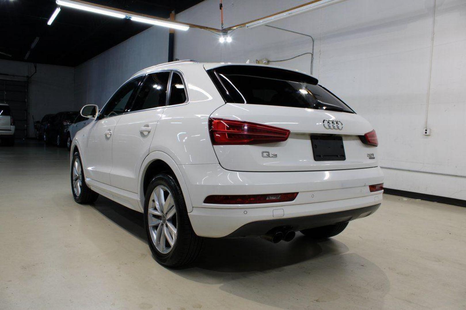 2018 White /Chestnut Brown Audi Q3 2.0T Premium (WA1JCCFS3JR) with an 2.0L 4-Cylinder TFSI engine, Automatic transmission, located at 15300 Midway Rd., Addison, TX, 75001, (972) 702-0011, 32.958321, -96.838074 - HOME OF THE NO HAGGLE PRICE - WHOLESALE PRICES TO THE PUBLIC!! Priced below KBB Fair Purchase Price!<br><br>White 2018 Audi Q3 2.0T Premium<br><br>20/28 City/Highway MPG<br><br>Awards:<br> * 2018 KBB.com 10 Best Luxury Cars Under $35,000 * 2018 KBB.com 10 Most Awarded Brands<br><br>At Midway Auto - Photo#3