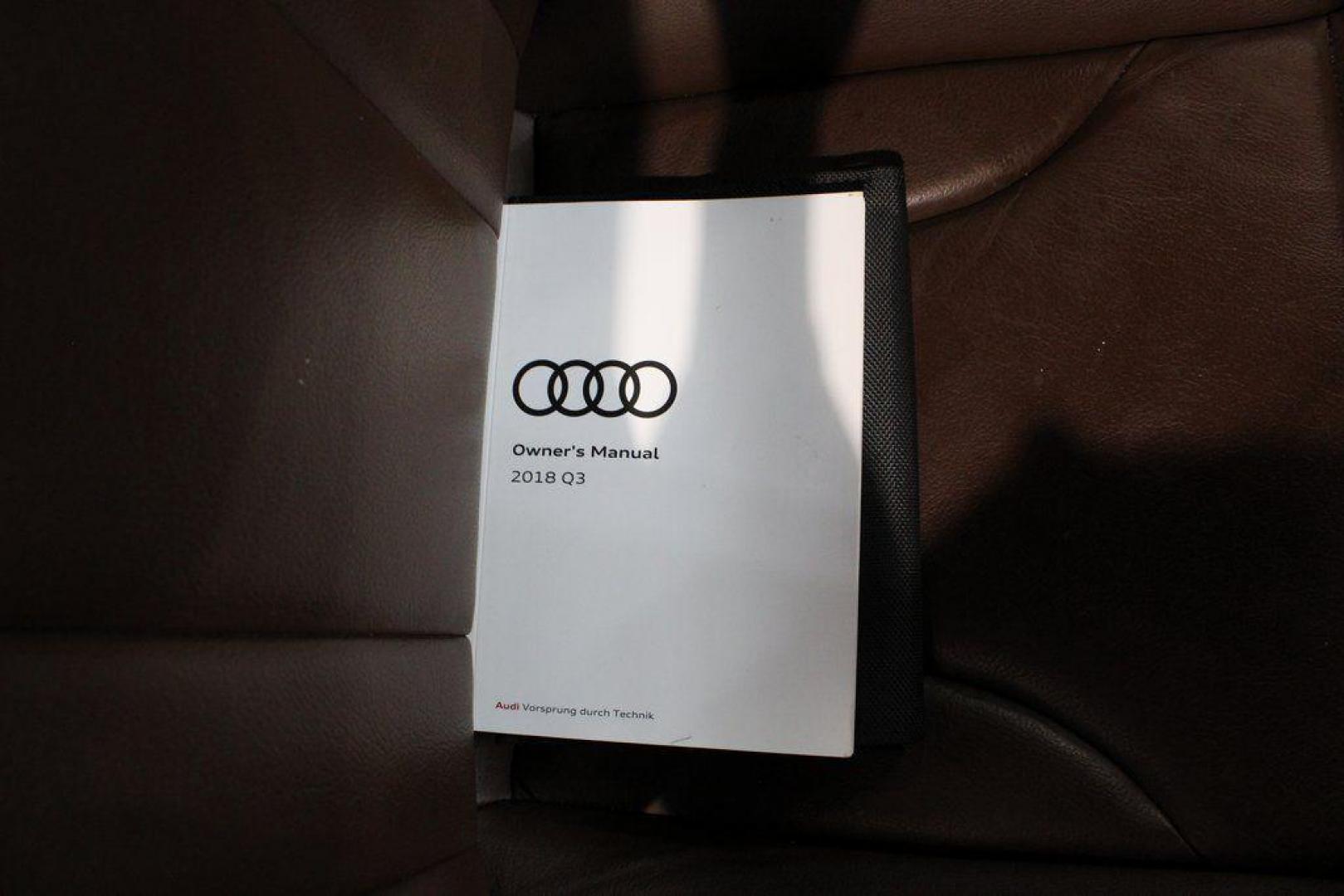 2018 White /Chestnut Brown Audi Q3 2.0T Premium (WA1JCCFS3JR) with an 2.0L 4-Cylinder TFSI engine, Automatic transmission, located at 15300 Midway Rd., Addison, TX, 75001, (972) 702-0011, 32.958321, -96.838074 - HOME OF THE NO HAGGLE PRICE - WHOLESALE PRICES TO THE PUBLIC!! Priced below KBB Fair Purchase Price!<br><br>White 2018 Audi Q3 2.0T Premium<br><br>20/28 City/Highway MPG<br><br>Awards:<br> * 2018 KBB.com 10 Best Luxury Cars Under $35,000 * 2018 KBB.com 10 Most Awarded Brands<br><br>At Midway Auto - Photo#8