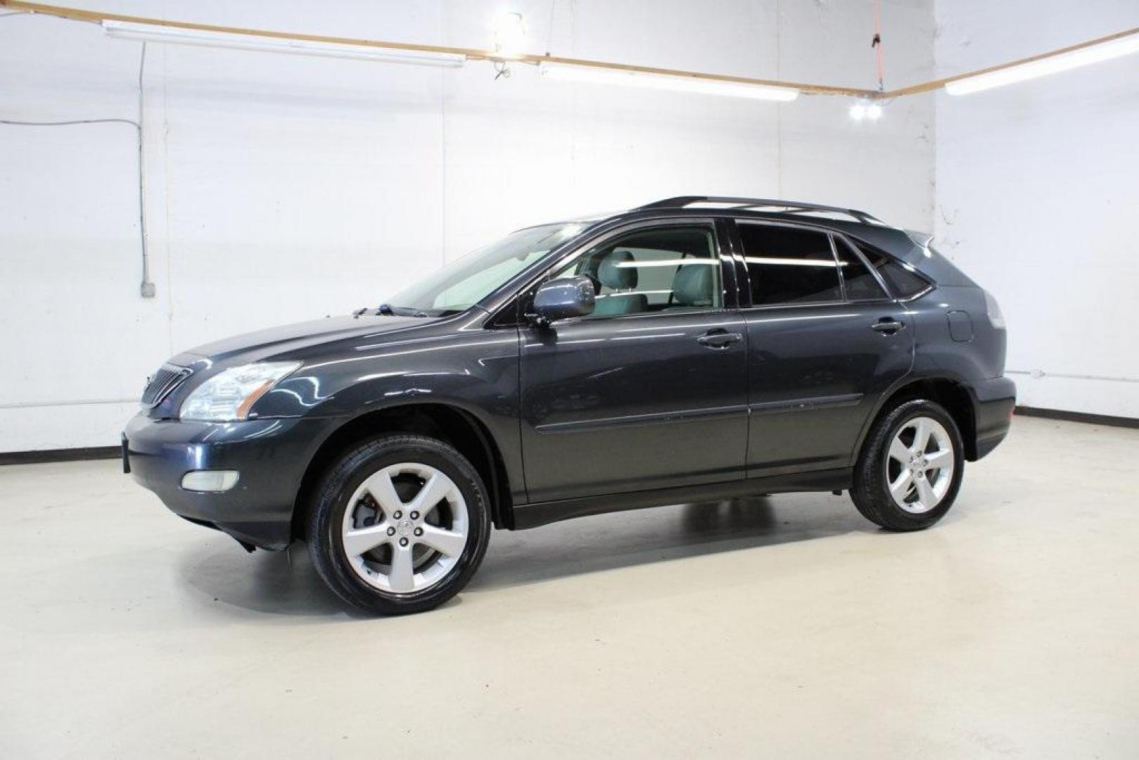 2005 Light Blue /Beige Lexus RX 330 (JTJGA31U850) with an 3.3L V6 SMPI DOHC 24V engine, Automatic transmission, located at 15300 Midway Rd., Addison, TX, 75001, (972) 702-0011, 32.958321, -96.838074 - Photo#4
