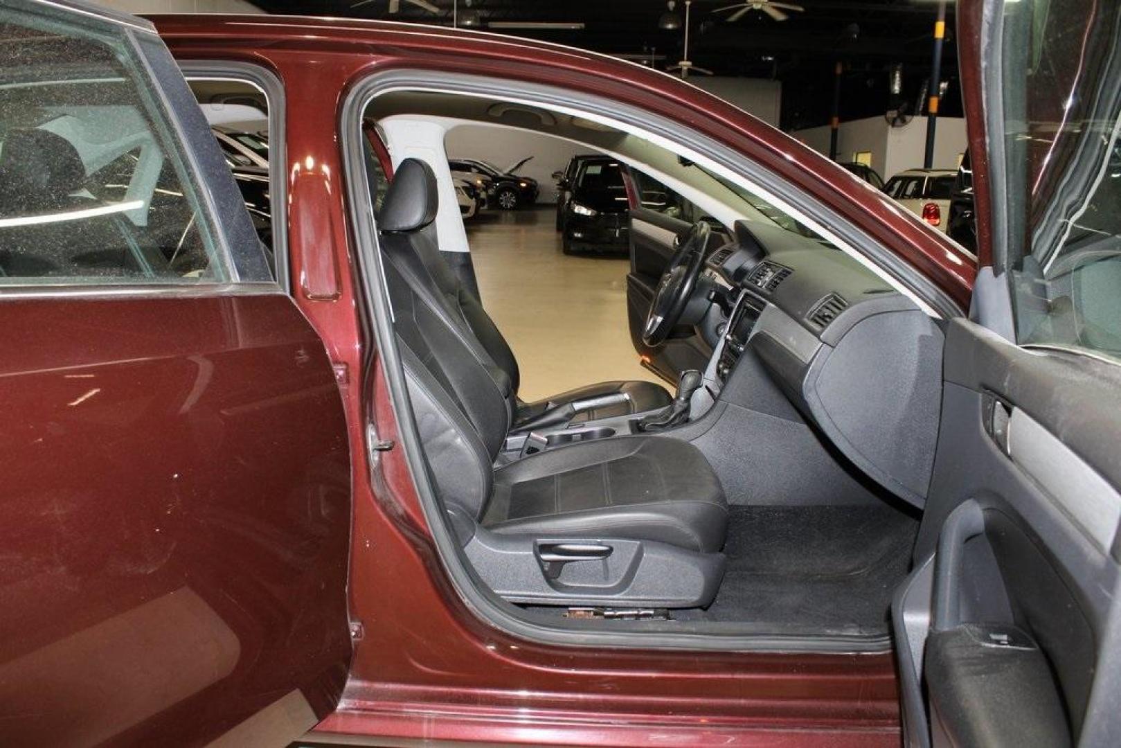2013 OPERA RED METALLIC /Titan Black Volkswagen Passat 2.5 SE (1VWBH7A39DC) with an 2.5L 5-Cylinder DOHC engine, Automatic transmission, located at 15300 Midway Rd., Addison, TX, 75001, (972) 702-0011, 32.958321, -96.838074 - HOME OF THE NO HAGGLE PRICE - WHOLESALE PRICES TO THE PUBLIC!! Odometer is 27352 miles below market average!<br><br>OPERA RED METALLIC 2013 Volkswagen Passat 2.5 SE<br><br>22/31 City/Highway MPG<br><br>Awards:<br> * 2013 KBB.com 10 Best New Sedans Under $25,000 * 2013 KBB.com 10 Best Family Cars< - Photo#9