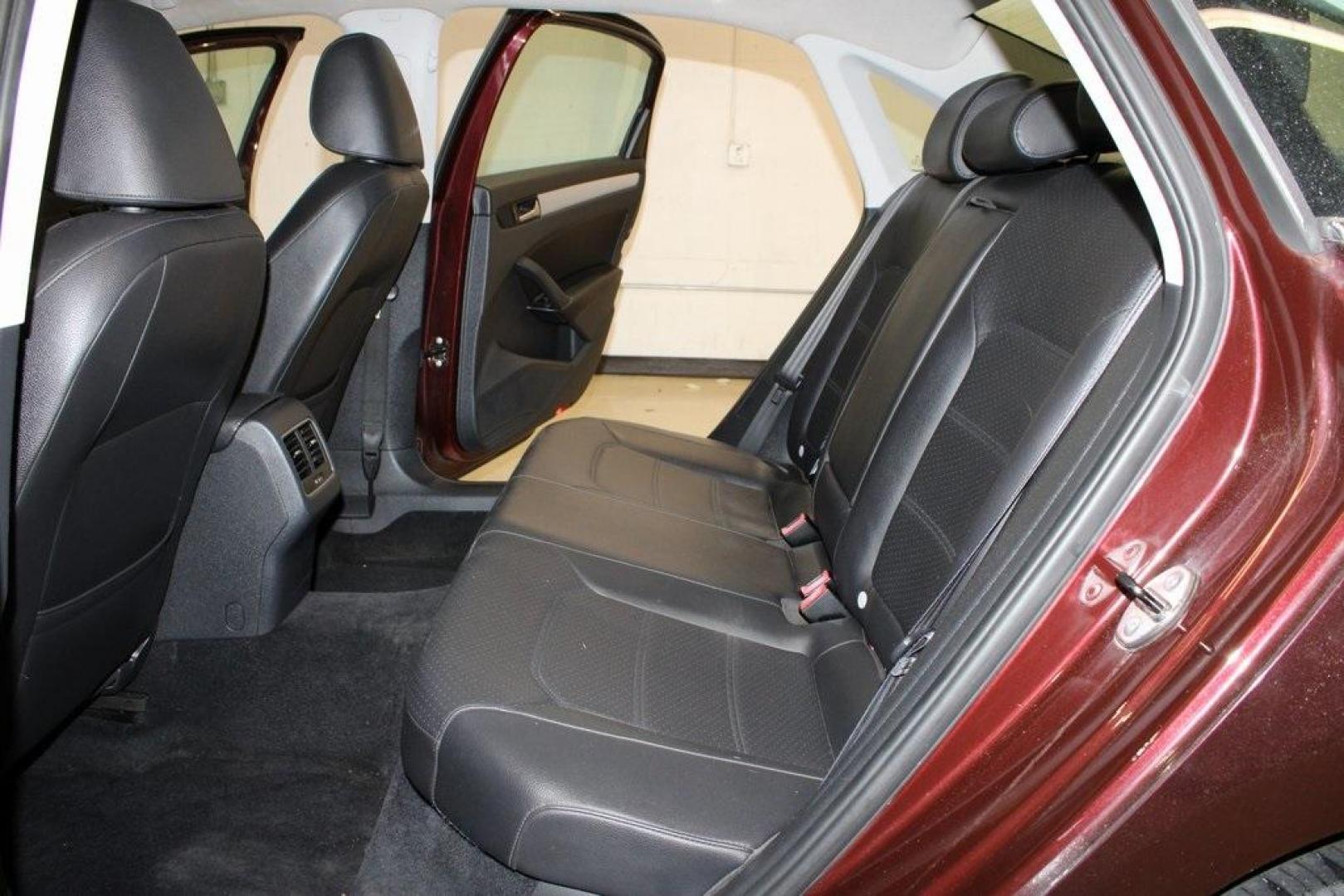 2013 OPERA RED METALLIC /Titan Black Volkswagen Passat 2.5 SE (1VWBH7A39DC) with an 2.5L 5-Cylinder DOHC engine, Automatic transmission, located at 15300 Midway Rd., Addison, TX, 75001, (972) 702-0011, 32.958321, -96.838074 - HOME OF THE NO HAGGLE PRICE - WHOLESALE PRICES TO THE PUBLIC!! Odometer is 27352 miles below market average!<br><br>OPERA RED METALLIC 2013 Volkswagen Passat 2.5 SE<br><br>22/31 City/Highway MPG<br><br>Awards:<br> * 2013 KBB.com 10 Best New Sedans Under $25,000 * 2013 KBB.com 10 Best Family Cars< - Photo#11