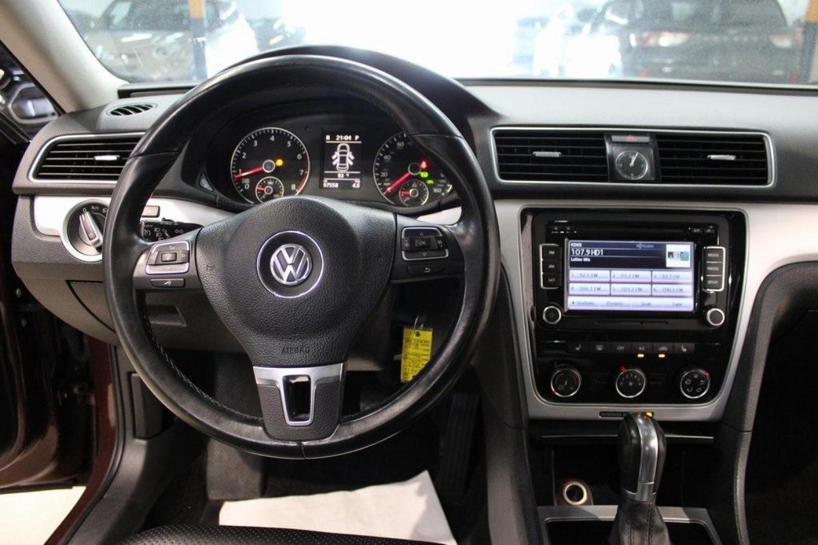 2013 OPERA RED METALLIC /Titan Black Volkswagen Passat 2.5 SE (1VWBH7A39DC) with an 2.5L 5-Cylinder DOHC engine, Automatic transmission, located at 15300 Midway Rd., Addison, TX, 75001, (972) 702-0011, 32.958321, -96.838074 - HOME OF THE NO HAGGLE PRICE - WHOLESALE PRICES TO THE PUBLIC!! Odometer is 27352 miles below market average!<br><br>OPERA RED METALLIC 2013 Volkswagen Passat 2.5 SE<br><br>22/31 City/Highway MPG<br><br>Awards:<br> * 2013 KBB.com 10 Best New Sedans Under $25,000 * 2013 KBB.com 10 Best Family Cars< - Photo#12