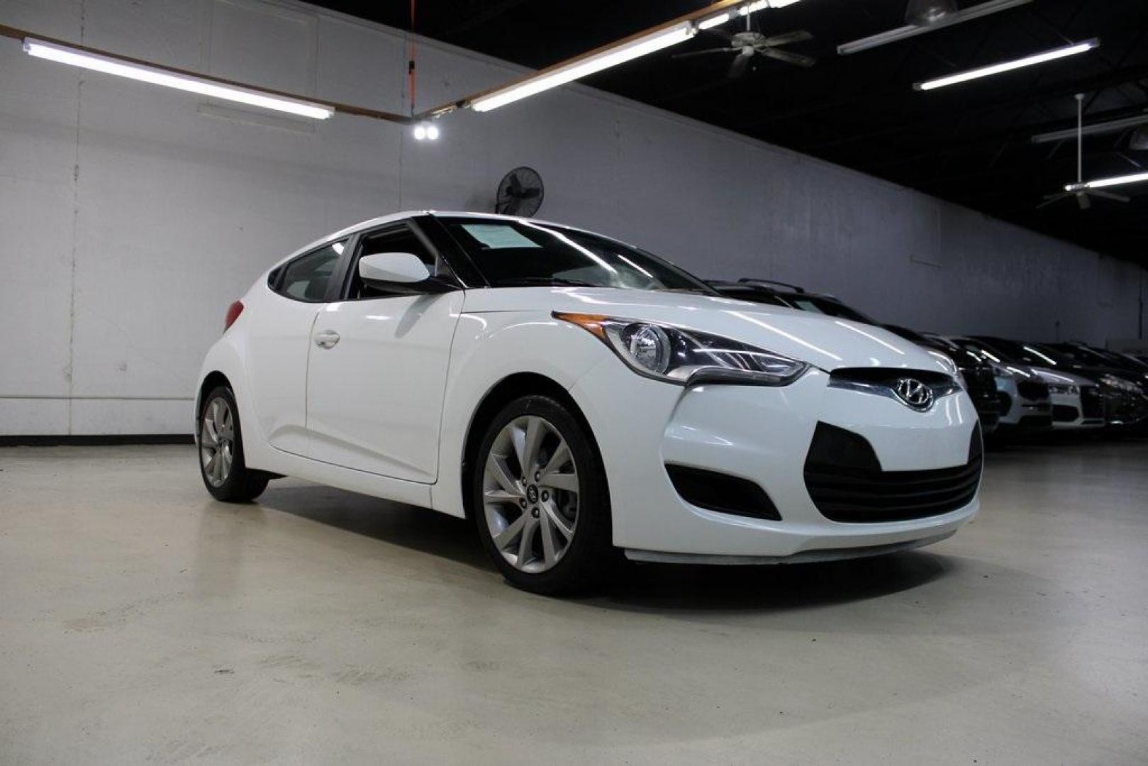 2016 Century White /Black Hyundai Veloster Base (KMHTC6AD4GU) with an 1.6L I4 DGI DOHC 16V ULEV II 132hp engine, Automatic transmission, located at 15300 Midway Rd., Addison, TX, 75001, (972) 702-0011, 32.958321, -96.838074 - 2016 Hyundai Veloster Base<br>Now Available at Midway Auto Group Addison, Texas<br><br>Sporty, efficient, and full of character, this 2016 Hyundai Veloster Base brings compact utility and fun-factor together seamlessly. With its distinctive 3-door hatchback design, confident performance, and modern - Photo#1