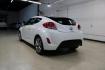 2016 Century White /Black Hyundai Veloster Base (KMHTC6AD4GU) with an 1.6L I4 DGI DOHC 16V ULEV II 132hp engine, Automatic transmission, located at 15300 Midway Rd., Addison, TX, 75001, (972) 702-0011, 32.958321, -96.838074 - 2016 Hyundai Veloster Base<br>Now Available at Midway Auto Group Addison, Texas<br><br>Sporty, efficient, and full of character, this 2016 Hyundai Veloster Base brings compact utility and fun-factor together seamlessly. With its distinctive 3-door hatchback design, confident performance, and modern - Photo#3