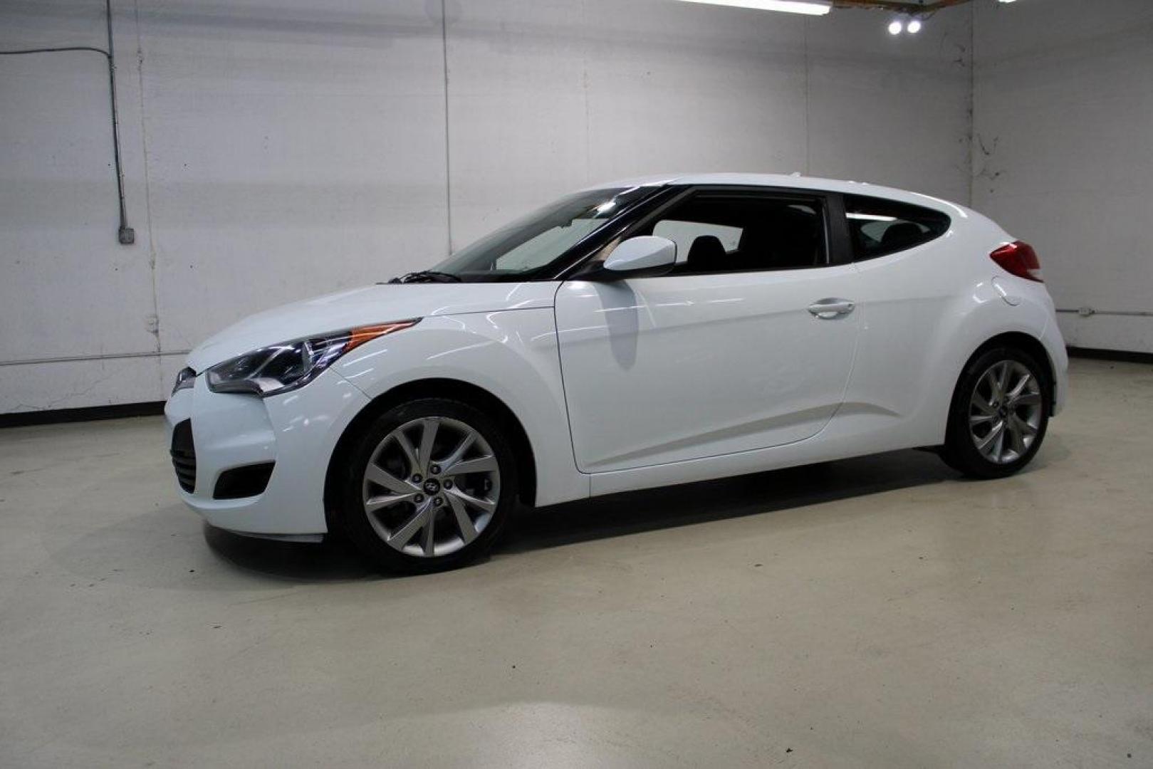 2016 Century White /Black Hyundai Veloster Base (KMHTC6AD4GU) with an 1.6L I4 DGI DOHC 16V ULEV II 132hp engine, Automatic transmission, located at 15300 Midway Rd., Addison, TX, 75001, (972) 702-0011, 32.958321, -96.838074 - 2016 Hyundai Veloster Base<br>Now Available at Midway Auto Group Addison, Texas<br><br>Sporty, efficient, and full of character, this 2016 Hyundai Veloster Base brings compact utility and fun-factor together seamlessly. With its distinctive 3-door hatchback design, confident performance, and modern - Photo#4