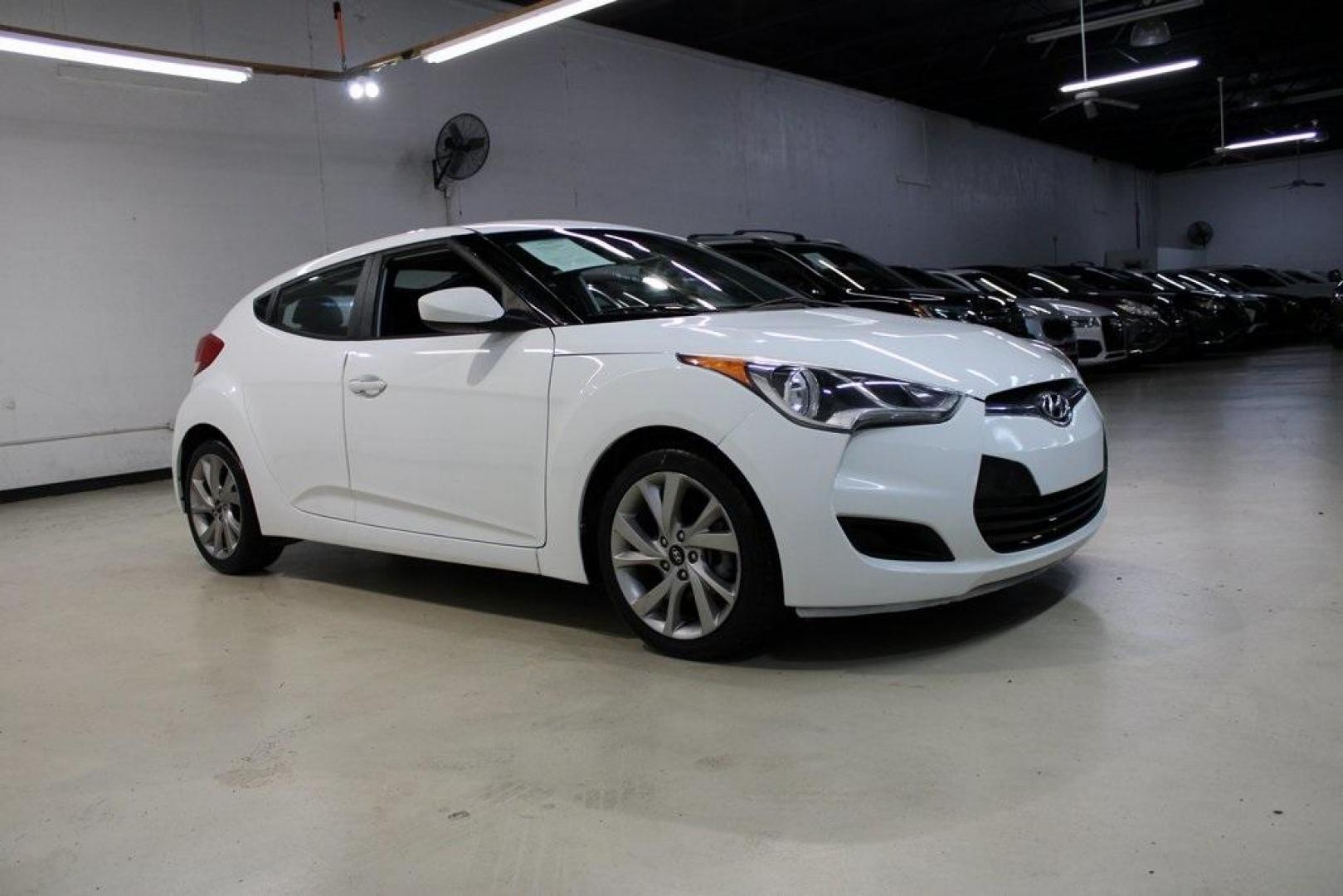 2016 Century White /Black Hyundai Veloster Base (KMHTC6AD4GU) with an 1.6L I4 DGI DOHC 16V ULEV II 132hp engine, Automatic transmission, located at 15300 Midway Rd., Addison, TX, 75001, (972) 702-0011, 32.958321, -96.838074 - 2016 Hyundai Veloster Base<br>Now Available at Midway Auto Group Addison, Texas<br><br>Sporty, efficient, and full of character, this 2016 Hyundai Veloster Base brings compact utility and fun-factor together seamlessly. With its distinctive 3-door hatchback design, confident performance, and modern - Photo#6