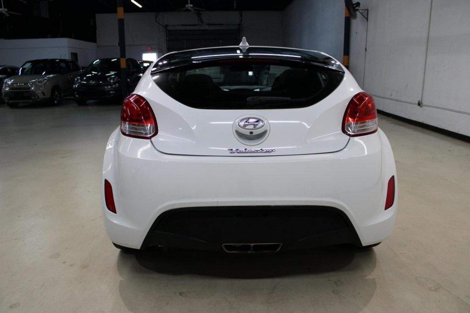 2016 Century White /Black Hyundai Veloster Base (KMHTC6AD4GU) with an 1.6L I4 DGI DOHC 16V ULEV II 132hp engine, Automatic transmission, located at 15300 Midway Rd., Addison, TX, 75001, (972) 702-0011, 32.958321, -96.838074 - 2016 Hyundai Veloster Base<br>Now Available at Midway Auto Group Addison, Texas<br><br>Sporty, efficient, and full of character, this 2016 Hyundai Veloster Base brings compact utility and fun-factor together seamlessly. With its distinctive 3-door hatchback design, confident performance, and modern - Photo#7