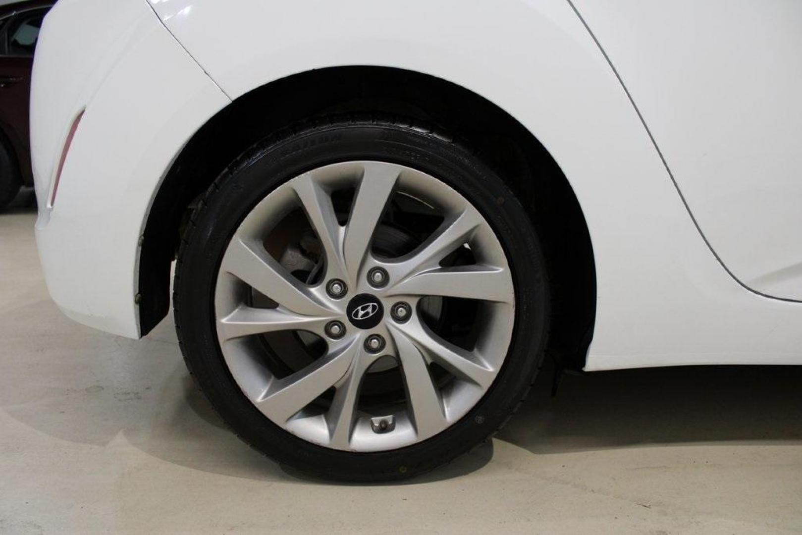 2016 Century White /Black Hyundai Veloster Base (KMHTC6AD4GU) with an 1.6L I4 DGI DOHC 16V ULEV II 132hp engine, Automatic transmission, located at 15300 Midway Rd., Addison, TX, 75001, (972) 702-0011, 32.958321, -96.838074 - 2016 Hyundai Veloster Base<br>Now Available at Midway Auto Group Addison, Texas<br><br>Sporty, efficient, and full of character, this 2016 Hyundai Veloster Base brings compact utility and fun-factor together seamlessly. With its distinctive 3-door hatchback design, confident performance, and modern - Photo#10