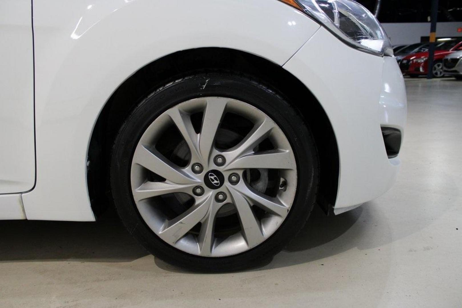2016 Century White /Black Hyundai Veloster Base (KMHTC6AD4GU) with an 1.6L I4 DGI DOHC 16V ULEV II 132hp engine, Automatic transmission, located at 15300 Midway Rd., Addison, TX, 75001, (972) 702-0011, 32.958321, -96.838074 - 2016 Hyundai Veloster Base<br>Now Available at Midway Auto Group Addison, Texas<br><br>Sporty, efficient, and full of character, this 2016 Hyundai Veloster Base brings compact utility and fun-factor together seamlessly. With its distinctive 3-door hatchback design, confident performance, and modern - Photo#11