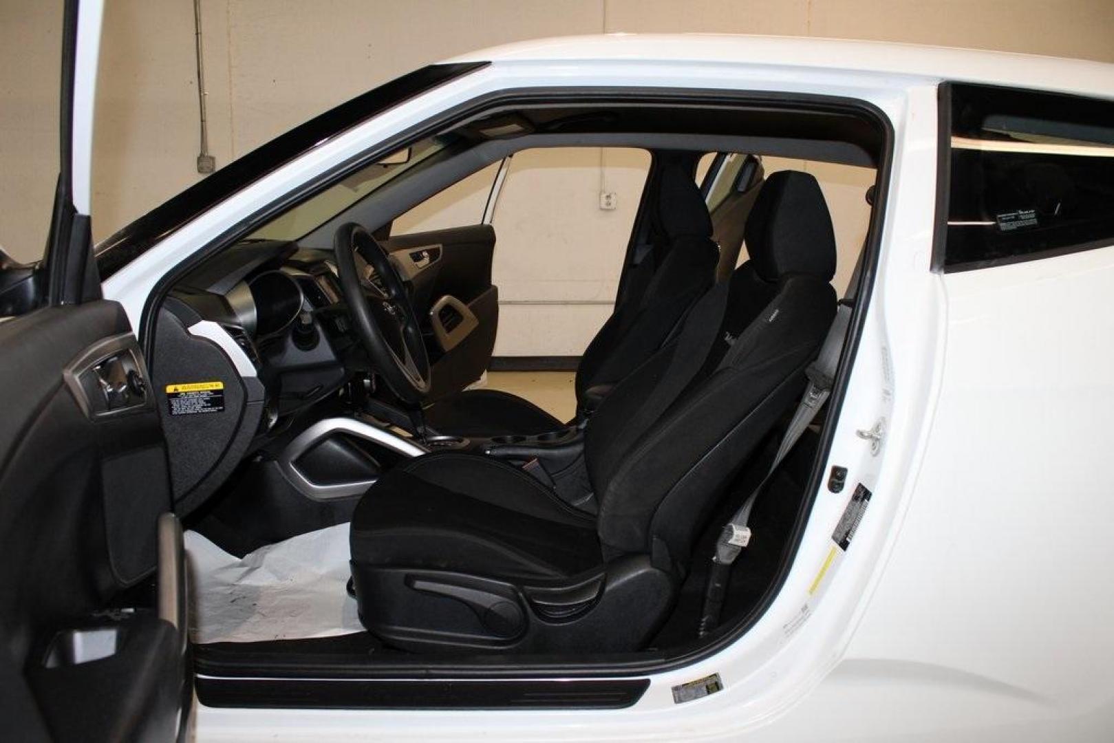 2016 Century White /Black Hyundai Veloster Base (KMHTC6AD4GU) with an 1.6L I4 DGI DOHC 16V ULEV II 132hp engine, Automatic transmission, located at 15300 Midway Rd., Addison, TX, 75001, (972) 702-0011, 32.958321, -96.838074 - 2016 Hyundai Veloster Base<br>Now Available at Midway Auto Group Addison, Texas<br><br>Sporty, efficient, and full of character, this 2016 Hyundai Veloster Base brings compact utility and fun-factor together seamlessly. With its distinctive 3-door hatchback design, confident performance, and modern - Photo#12