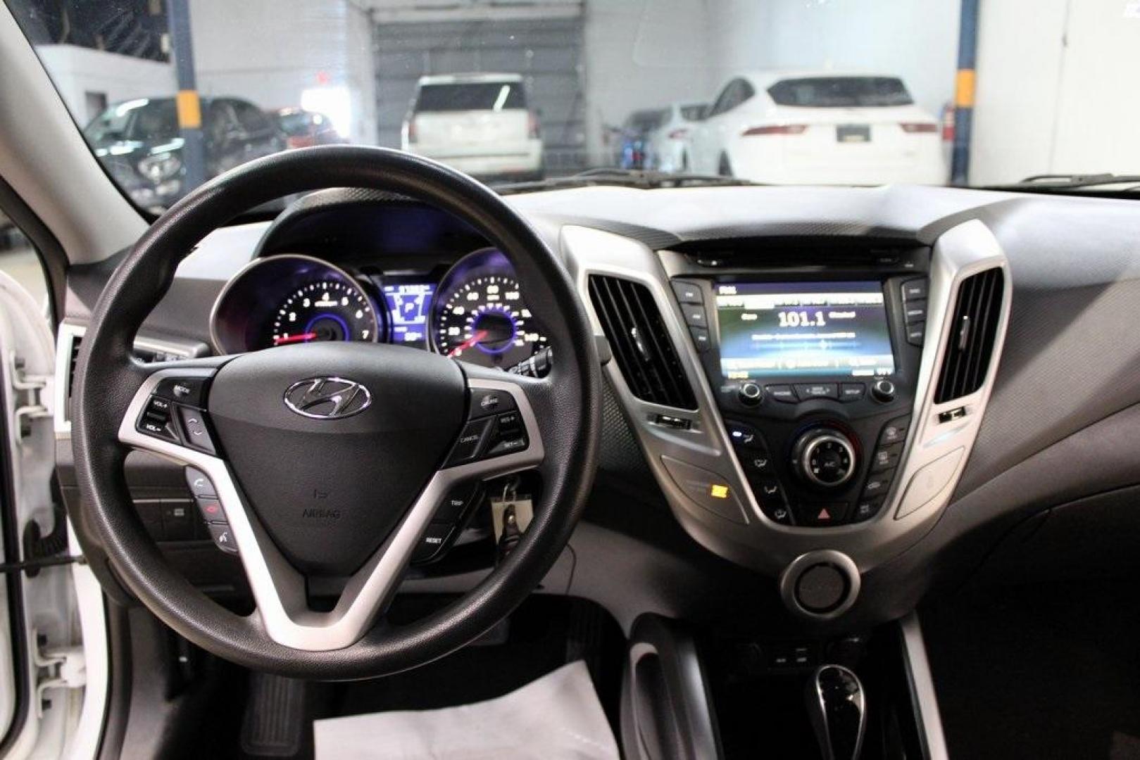 2016 Century White /Black Hyundai Veloster Base (KMHTC6AD4GU) with an 1.6L I4 DGI DOHC 16V ULEV II 132hp engine, Automatic transmission, located at 15300 Midway Rd., Addison, TX, 75001, (972) 702-0011, 32.958321, -96.838074 - 2016 Hyundai Veloster Base<br>Now Available at Midway Auto Group Addison, Texas<br><br>Sporty, efficient, and full of character, this 2016 Hyundai Veloster Base brings compact utility and fun-factor together seamlessly. With its distinctive 3-door hatchback design, confident performance, and modern - Photo#15