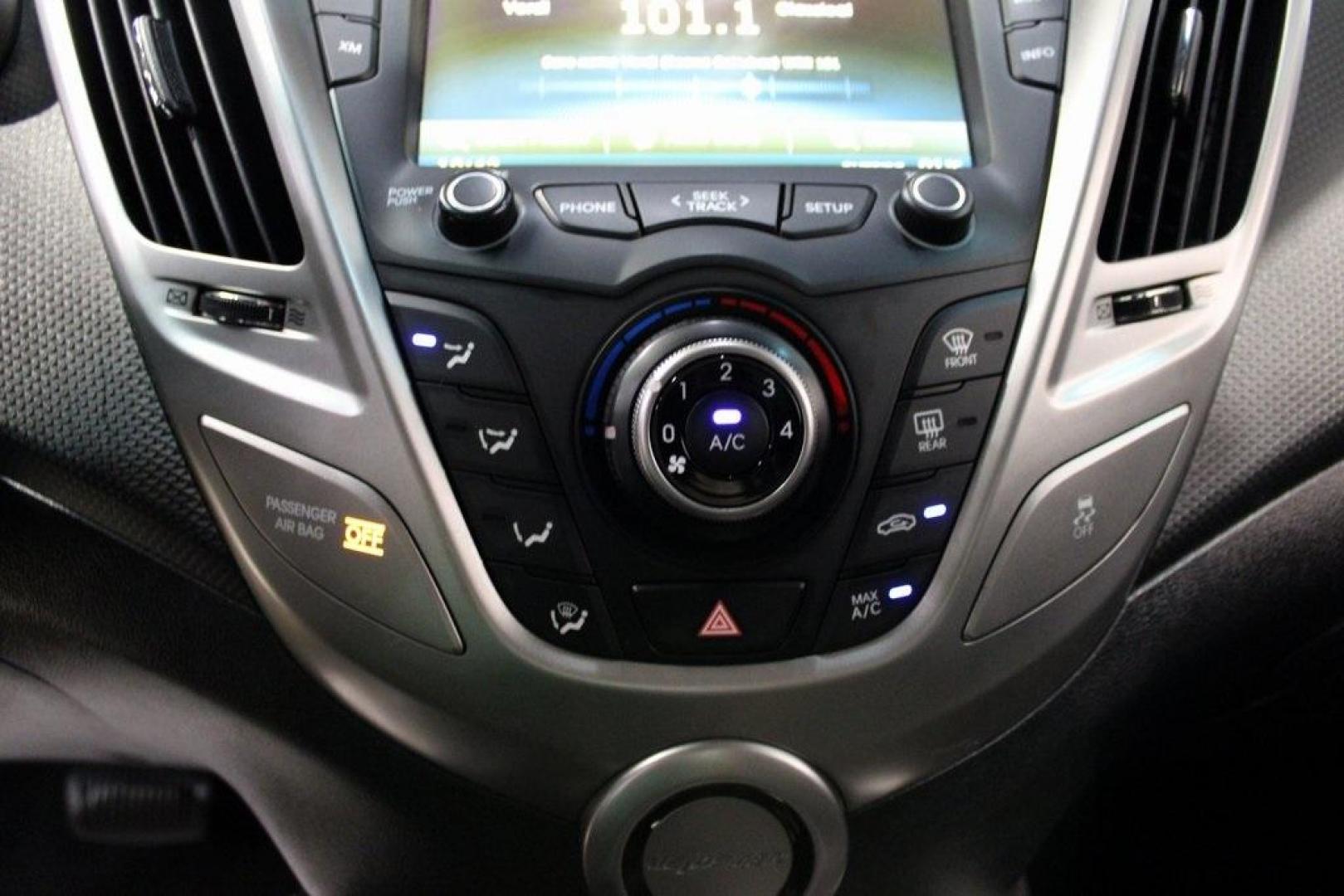 2016 Century White /Black Hyundai Veloster Base (KMHTC6AD4GU) with an 1.6L I4 DGI DOHC 16V ULEV II 132hp engine, Automatic transmission, located at 15300 Midway Rd., Addison, TX, 75001, (972) 702-0011, 32.958321, -96.838074 - 2016 Hyundai Veloster Base<br>Now Available at Midway Auto Group Addison, Texas<br><br>Sporty, efficient, and full of character, this 2016 Hyundai Veloster Base brings compact utility and fun-factor together seamlessly. With its distinctive 3-door hatchback design, confident performance, and modern - Photo#18