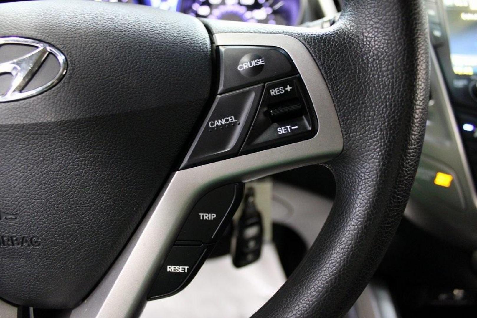 2016 Century White /Black Hyundai Veloster Base (KMHTC6AD4GU) with an 1.6L I4 DGI DOHC 16V ULEV II 132hp engine, Automatic transmission, located at 15300 Midway Rd., Addison, TX, 75001, (972) 702-0011, 32.958321, -96.838074 - 2016 Hyundai Veloster Base<br>Now Available at Midway Auto Group Addison, Texas<br><br>Sporty, efficient, and full of character, this 2016 Hyundai Veloster Base brings compact utility and fun-factor together seamlessly. With its distinctive 3-door hatchback design, confident performance, and modern - Photo#20