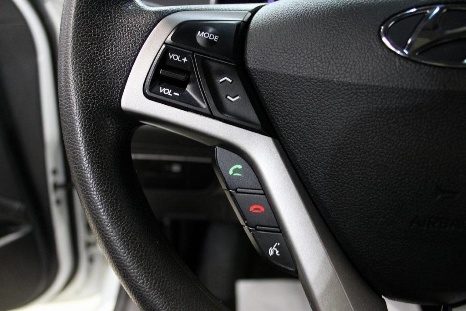 2016 Century White /Black Hyundai Veloster Base (KMHTC6AD4GU) with an 1.6L I4 DGI DOHC 16V ULEV II 132hp engine, Automatic transmission, located at 15300 Midway Rd., Addison, TX, 75001, (972) 702-0011, 32.958321, -96.838074 - 2016 Hyundai Veloster Base<br>Now Available at Midway Auto Group Addison, Texas<br><br>Sporty, efficient, and full of character, this 2016 Hyundai Veloster Base brings compact utility and fun-factor together seamlessly. With its distinctive 3-door hatchback design, confident performance, and modern - Photo#21