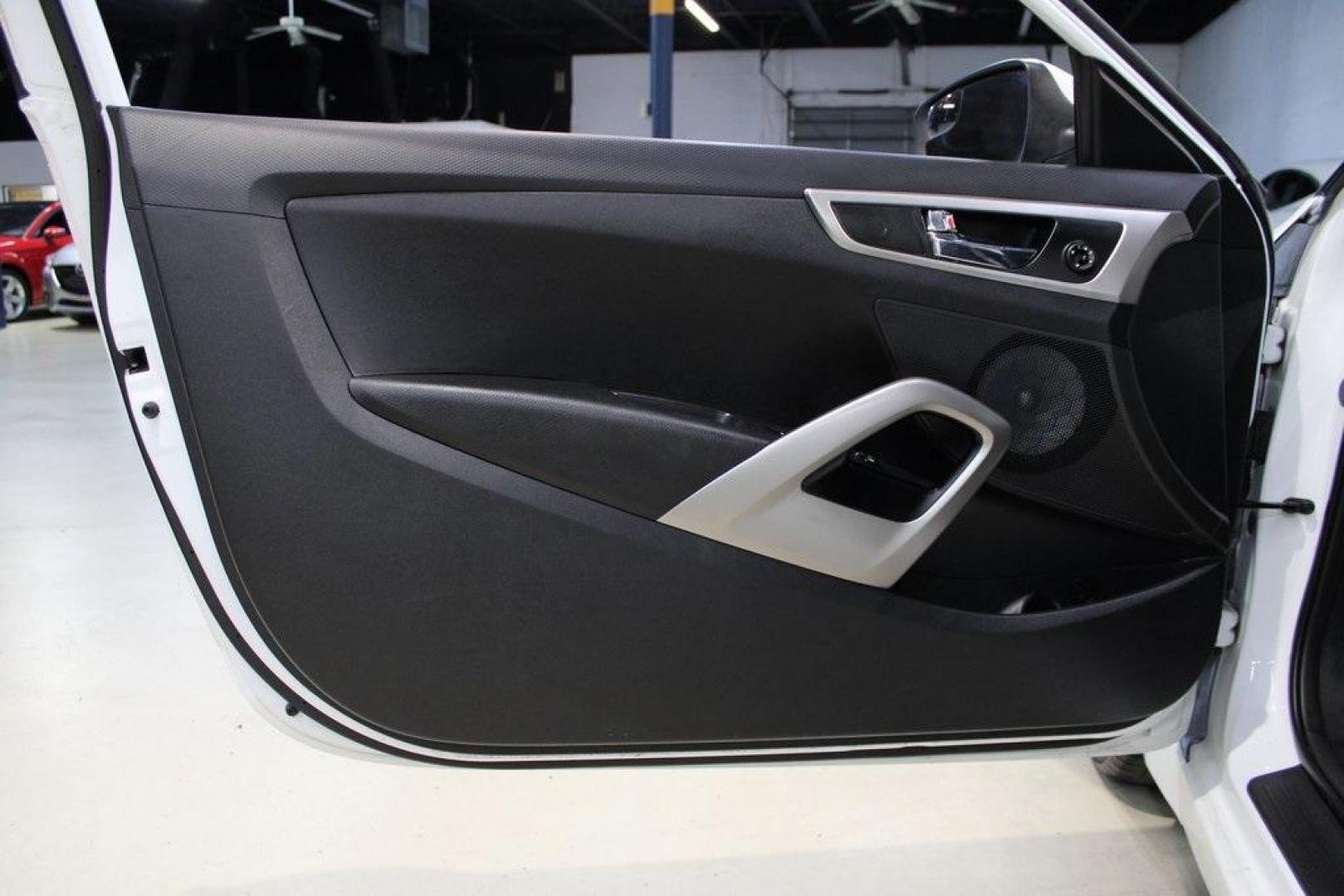2016 Century White /Black Hyundai Veloster Base (KMHTC6AD4GU) with an 1.6L I4 DGI DOHC 16V ULEV II 132hp engine, Automatic transmission, located at 15300 Midway Rd., Addison, TX, 75001, (972) 702-0011, 32.958321, -96.838074 - 2016 Hyundai Veloster Base<br>Now Available at Midway Auto Group Addison, Texas<br><br>Sporty, efficient, and full of character, this 2016 Hyundai Veloster Base brings compact utility and fun-factor together seamlessly. With its distinctive 3-door hatchback design, confident performance, and modern - Photo#22