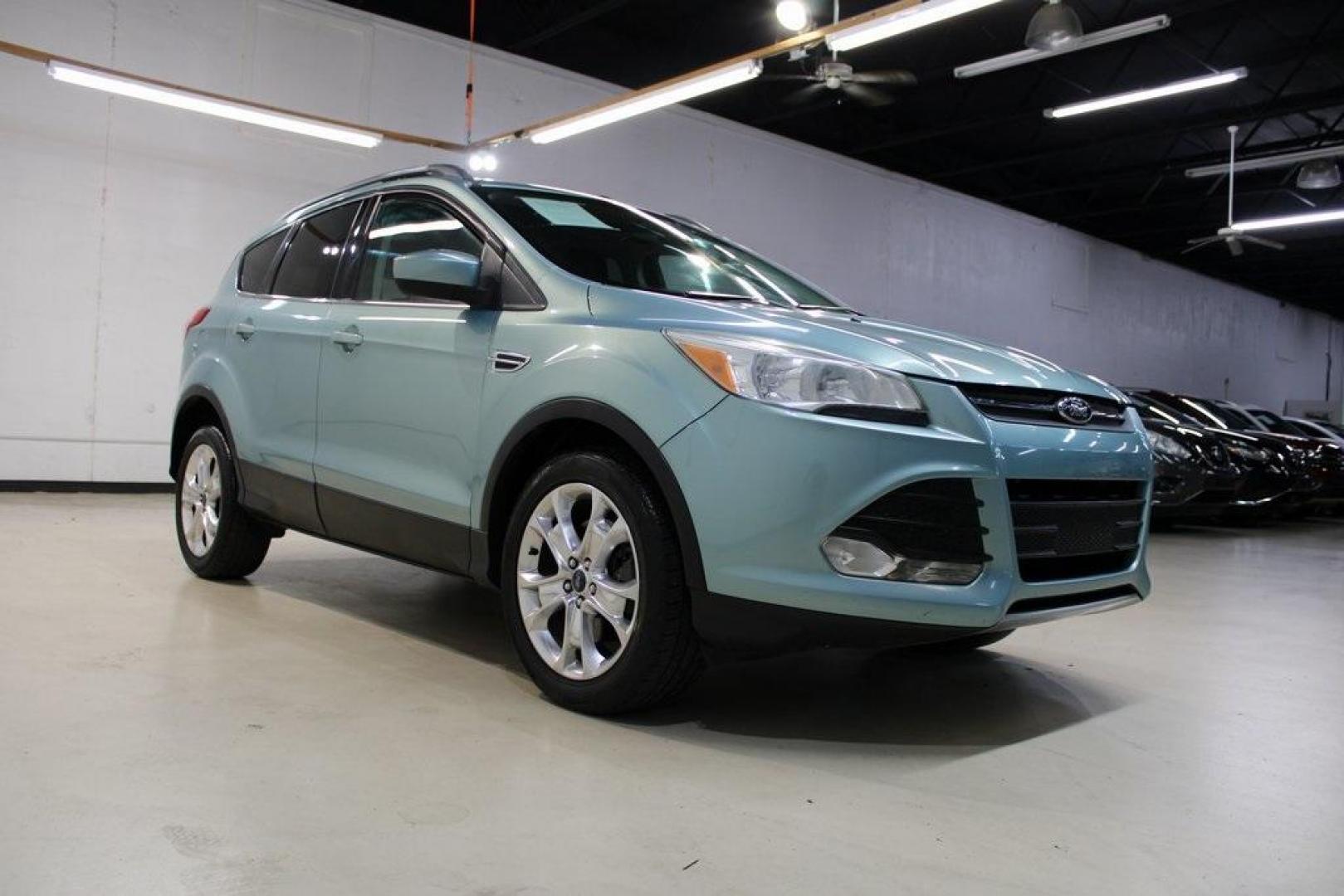 2013 Frosted Glass Metallic /Black Ford Escape SE (1FMCU9GX0DU) with an EcoBoost 1.6L I4 GTDi DOHC Turbocharged VCT engine, Automatic transmission, located at 15300 Midway Rd., Addison, TX, 75001, (972) 702-0011, 32.958321, -96.838074 - Photo#1
