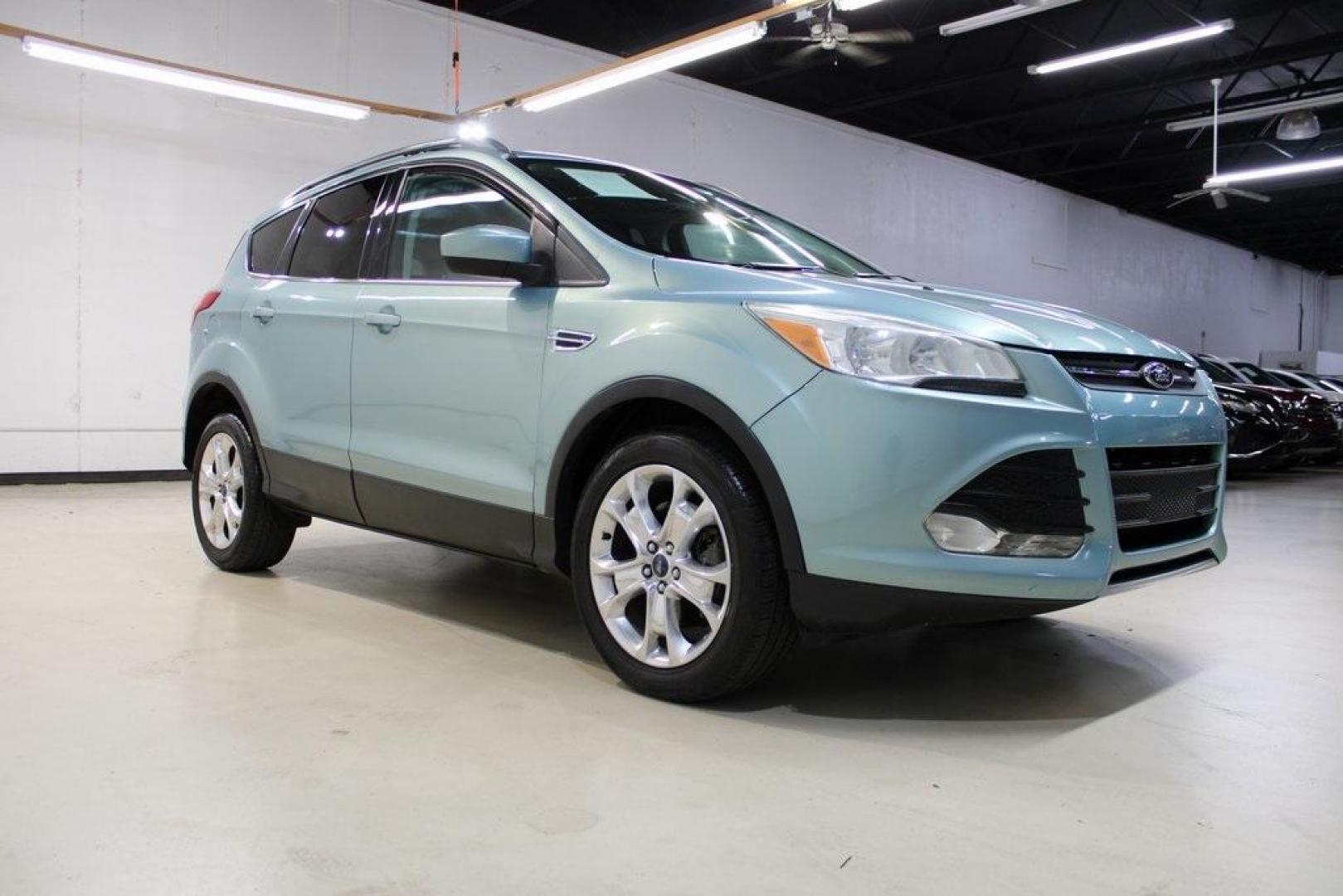 2013 Frosted Glass Metallic /Black Ford Escape SE (1FMCU9GX0DU) with an EcoBoost 1.6L I4 GTDi DOHC Turbocharged VCT engine, Automatic transmission, located at 15300 Midway Rd., Addison, TX, 75001, (972) 702-0011, 32.958321, -96.838074 - Photo#2