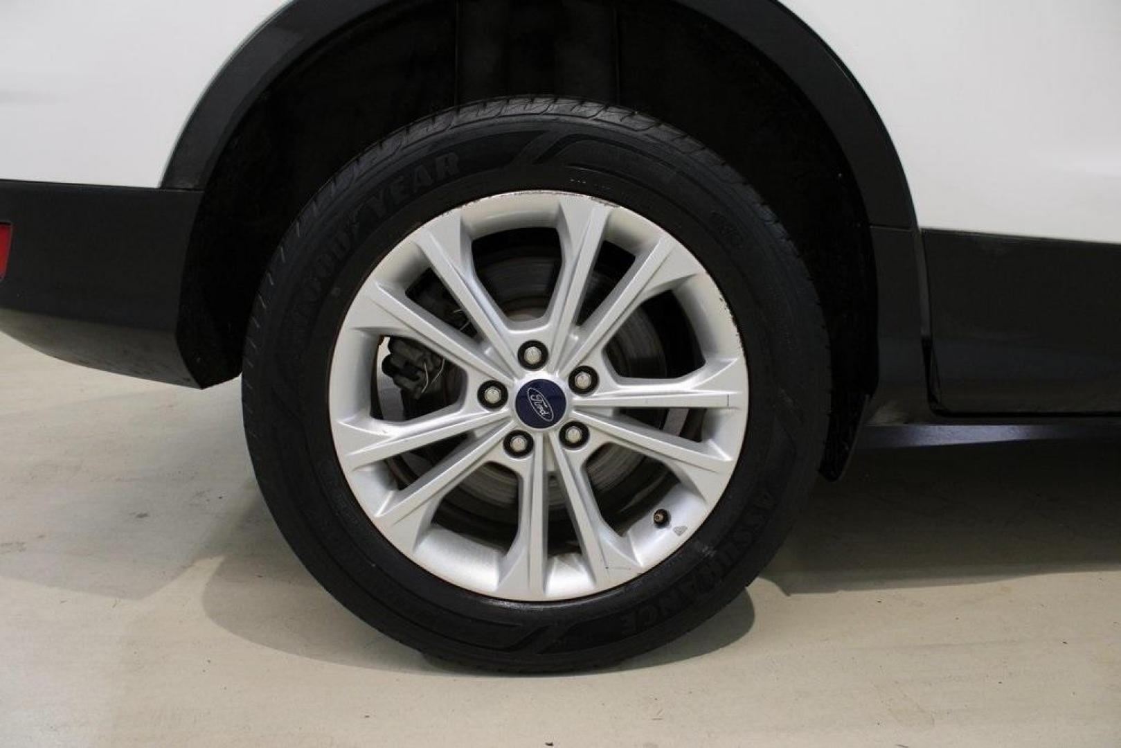 2018 Oxford White /Medium Light Stone Ford Escape SE (1FMCU0G99JU) with an EcoBoost 1.5L I4 GTDi DOHC Turbocharged VCT engine, Automatic transmission, located at 15300 Midway Rd., Addison, TX, 75001, (972) 702-0011, 32.958321, -96.838074 - 2018 Ford Escape SE<br>Now Available at Midway Auto Group Addison, Texas<br><br>The 2018 Ford Escape SE blends sporty style with everyday practicality, making it a top pick for drivers who want comfort, technology, and versatility in a compact SUV. With a turbocharged engine, spacious interior, and - Photo#10