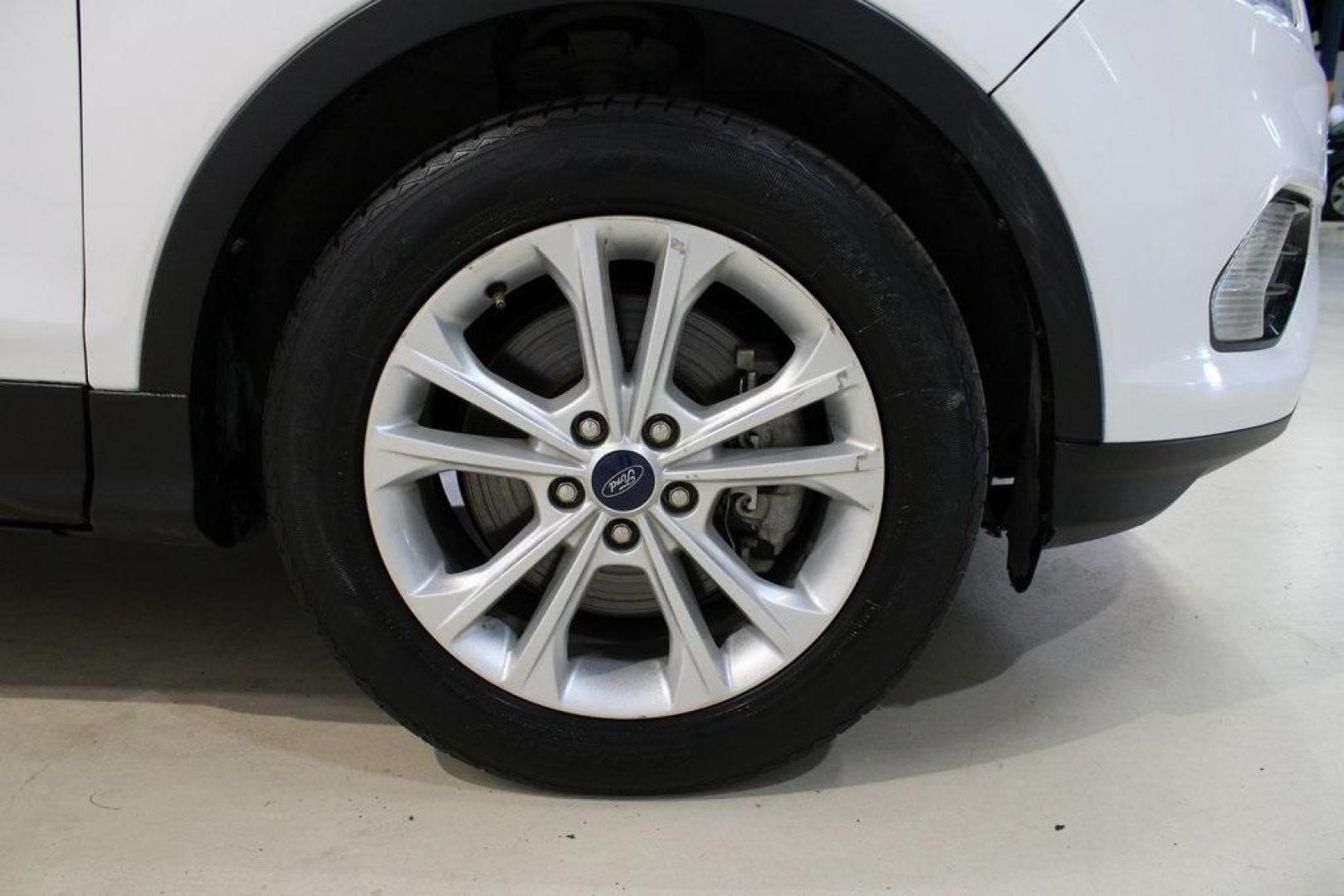 2018 Oxford White /Medium Light Stone Ford Escape SE (1FMCU0G99JU) with an EcoBoost 1.5L I4 GTDi DOHC Turbocharged VCT engine, Automatic transmission, located at 15300 Midway Rd., Addison, TX, 75001, (972) 702-0011, 32.958321, -96.838074 - 2018 Ford Escape SE<br>Now Available at Midway Auto Group Addison, Texas<br><br>The 2018 Ford Escape SE blends sporty style with everyday practicality, making it a top pick for drivers who want comfort, technology, and versatility in a compact SUV. With a turbocharged engine, spacious interior, and - Photo#11