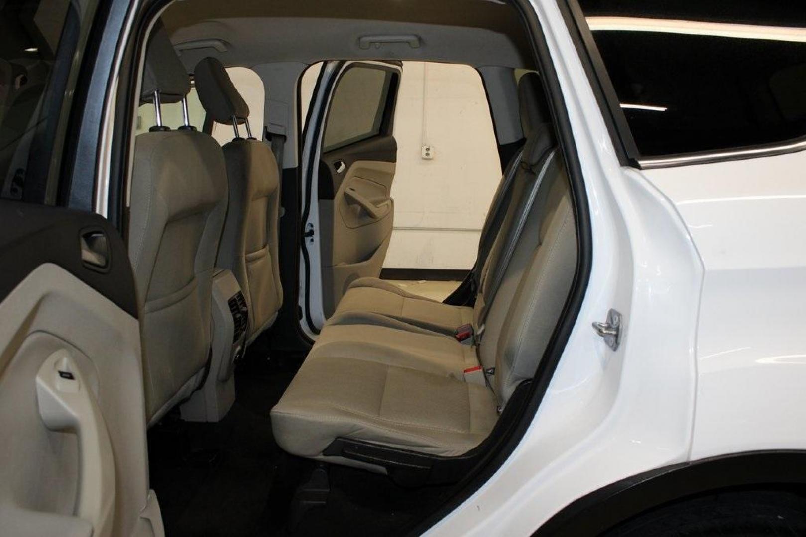 2018 Oxford White /Medium Light Stone Ford Escape SE (1FMCU0G99JU) with an EcoBoost 1.5L I4 GTDi DOHC Turbocharged VCT engine, Automatic transmission, located at 15300 Midway Rd., Addison, TX, 75001, (972) 702-0011, 32.958321, -96.838074 - 2018 Ford Escape SE<br>Now Available at Midway Auto Group Addison, Texas<br><br>The 2018 Ford Escape SE blends sporty style with everyday practicality, making it a top pick for drivers who want comfort, technology, and versatility in a compact SUV. With a turbocharged engine, spacious interior, and - Photo#16