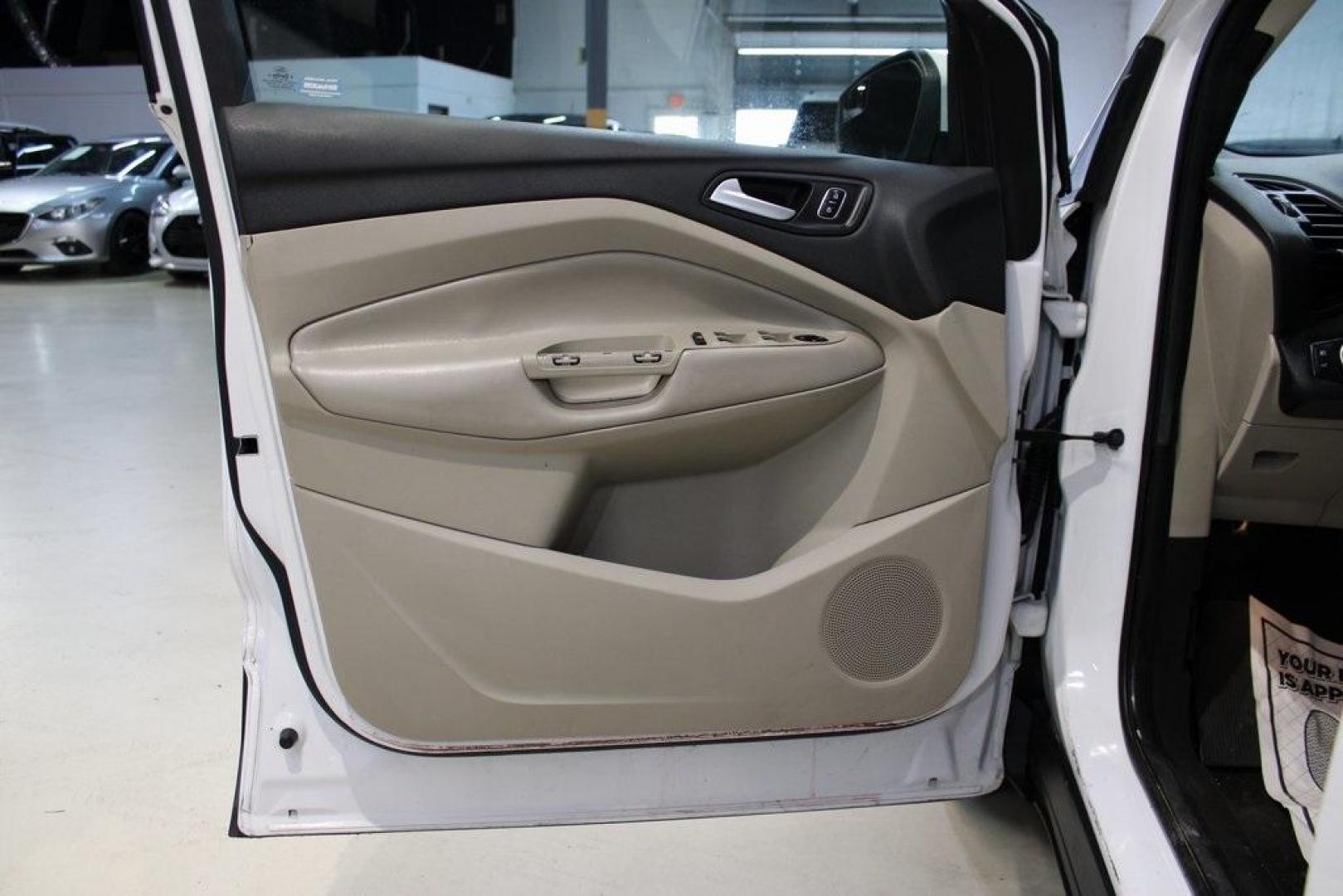 2018 Oxford White /Medium Light Stone Ford Escape SE (1FMCU0G99JU) with an EcoBoost 1.5L I4 GTDi DOHC Turbocharged VCT engine, Automatic transmission, located at 15300 Midway Rd., Addison, TX, 75001, (972) 702-0011, 32.958321, -96.838074 - 2018 Ford Escape SE<br>Now Available at Midway Auto Group Addison, Texas<br><br>The 2018 Ford Escape SE blends sporty style with everyday practicality, making it a top pick for drivers who want comfort, technology, and versatility in a compact SUV. With a turbocharged engine, spacious interior, and - Photo#25