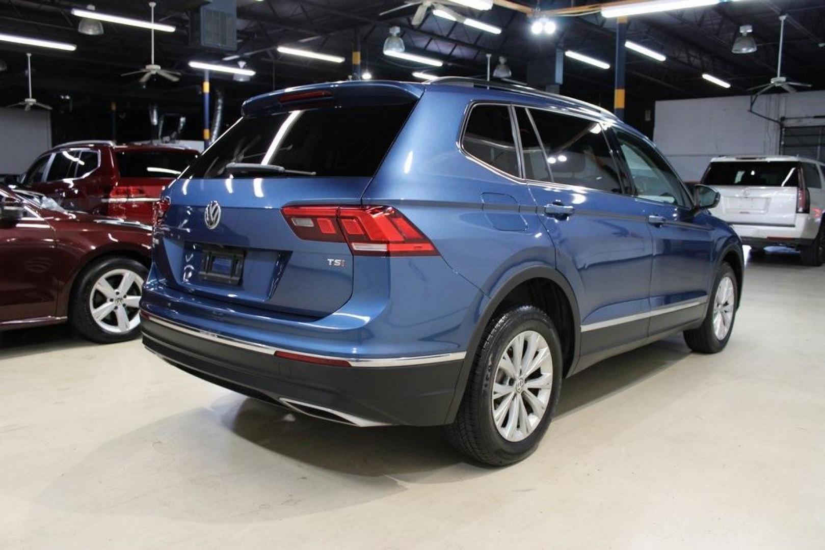 2018 Blue Metallic /Titan Black Volkswagen Tiguan 2.0T SE (3VV3B7AX7JM) with an 2.0L TSI DOHC engine, Automatic transmission, located at 15300 Midway Rd., Addison, TX, 75001, (972) 702-0011, 32.958321, -96.838074 - Photo#1