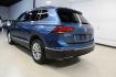 2018 Blue Metallic /Titan Black Volkswagen Tiguan 2.0T SE (3VV3B7AX7JM) with an 2.0L TSI DOHC engine, Automatic transmission, located at 15300 Midway Rd., Addison, TX, 75001, (972) 702-0011, 32.958321, -96.838074 - Photo#2