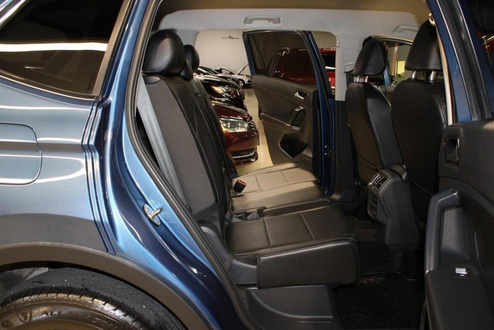 2018 Blue Metallic /Titan Black Volkswagen Tiguan 2.0T SE (3VV3B7AX7JM) with an 2.0L TSI DOHC engine, Automatic transmission, located at 15300 Midway Rd., Addison, TX, 75001, (972) 702-0011, 32.958321, -96.838074 - Photo#11