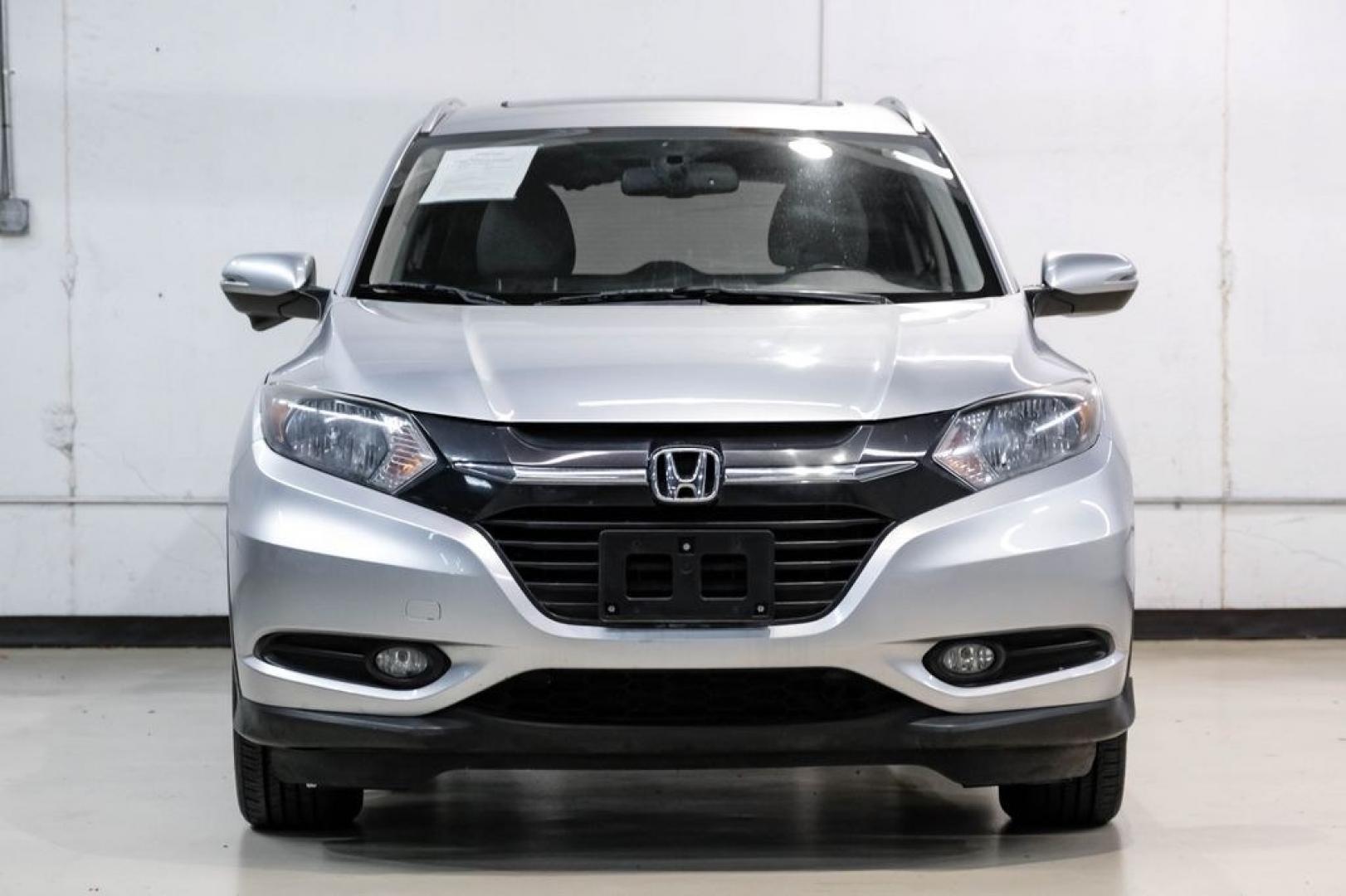 2016 Alabaster Silver Metallic /Black Honda HR-V EX-L (3CZRU5H76GM) with an 1.8L I4 SOHC 16V i-VTEC engine, CVT transmission, located at 15300 Midway Rd., Addison, TX, 75001, (972) 702-0011, 32.958321, -96.838074 - Photo#5