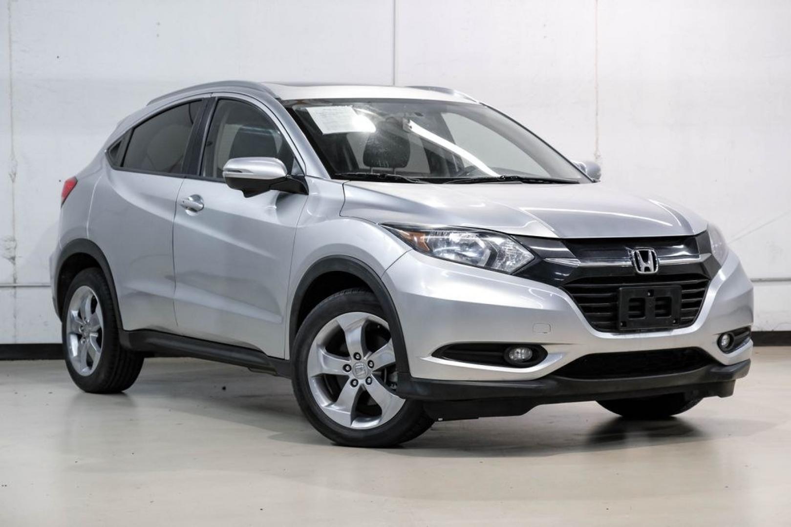 2016 Alabaster Silver Metallic /Black Honda HR-V EX-L (3CZRU5H76GM) with an 1.8L I4 SOHC 16V i-VTEC engine, CVT transmission, located at 15300 Midway Rd., Addison, TX, 75001, (972) 702-0011, 32.958321, -96.838074 - Photo#6