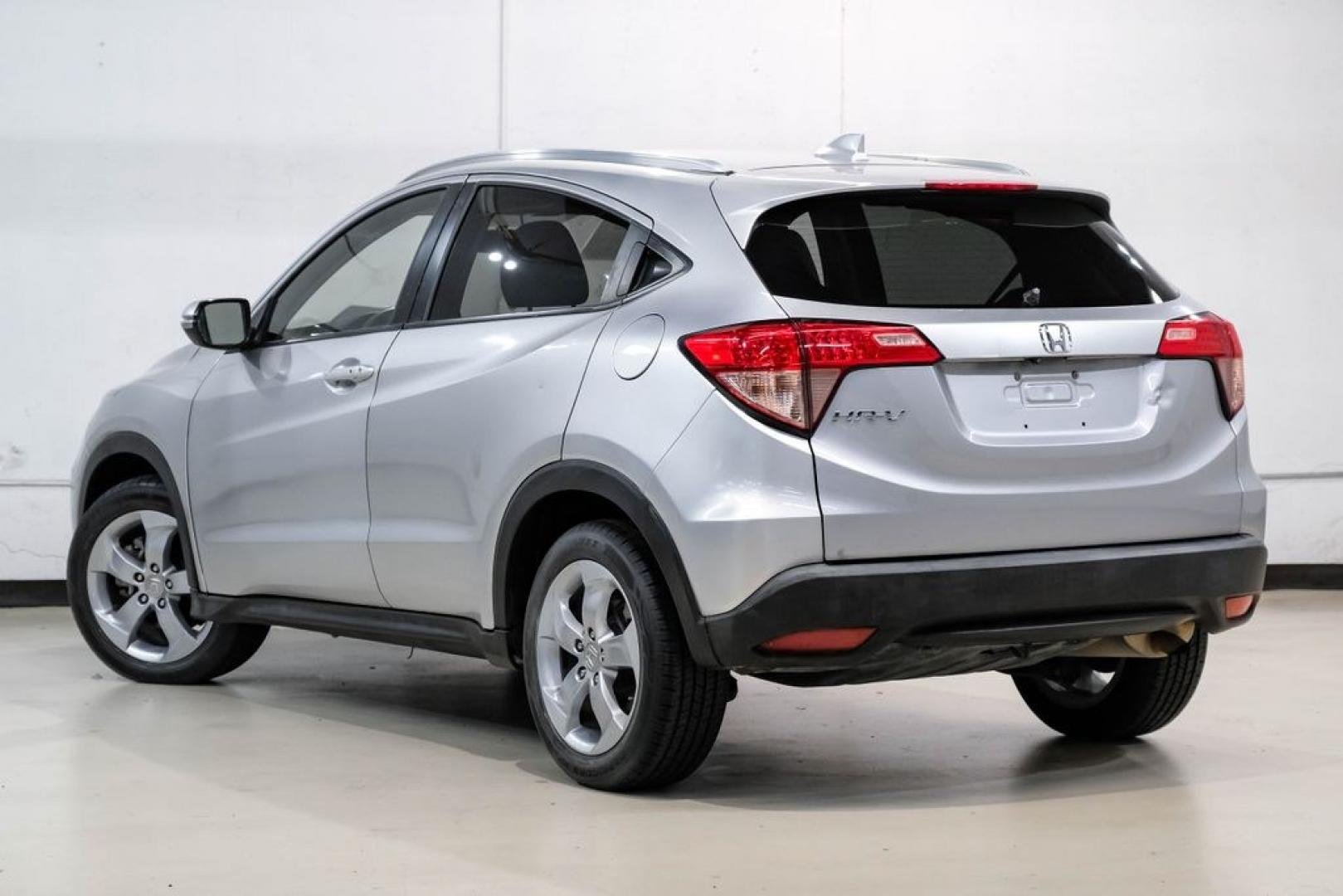 2016 Alabaster Silver Metallic /Black Honda HR-V EX-L (3CZRU5H76GM) with an 1.8L I4 SOHC 16V i-VTEC engine, CVT transmission, located at 15300 Midway Rd., Addison, TX, 75001, (972) 702-0011, 32.958321, -96.838074 - Photo#10