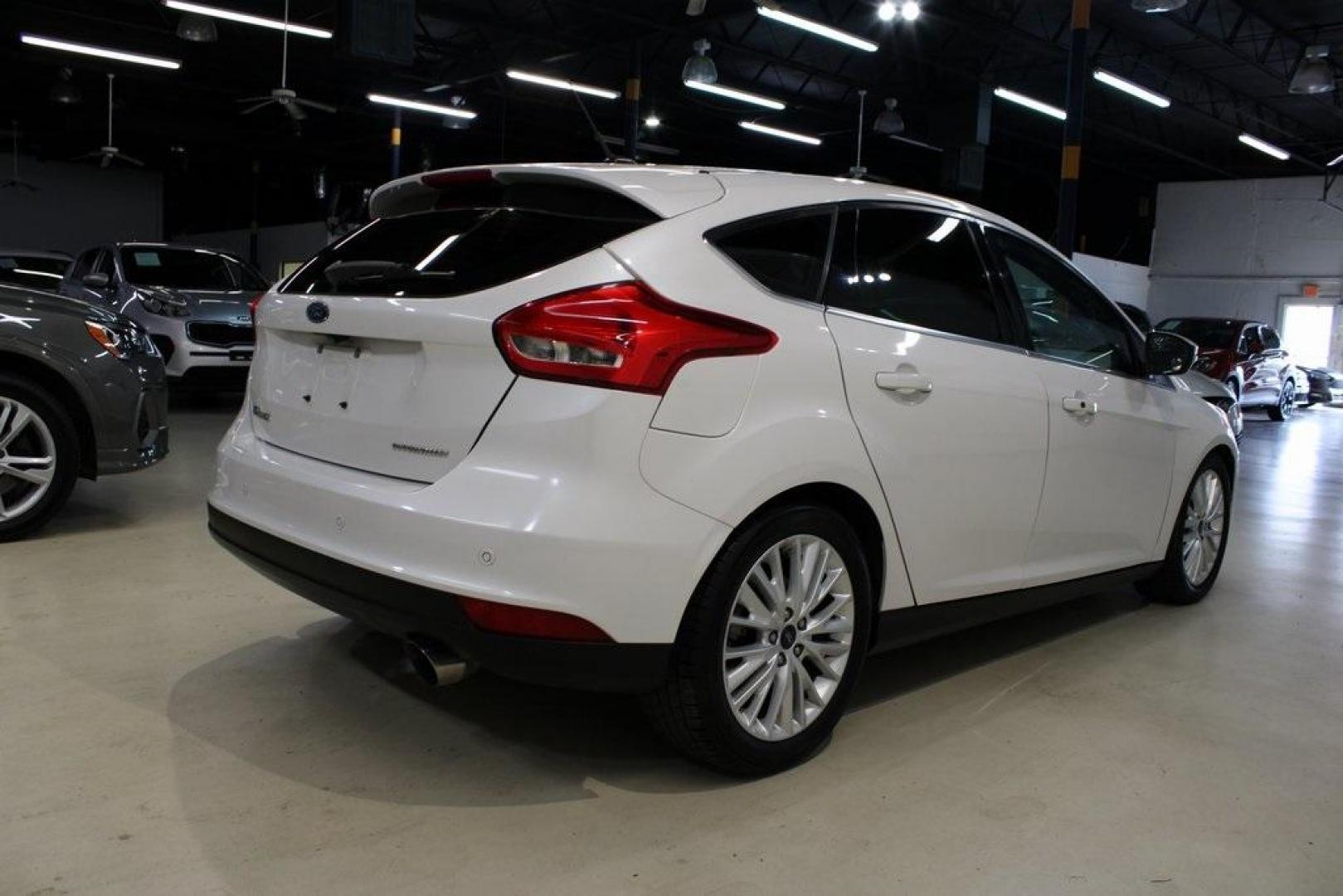 2017 White Platinum Clearcoat Metallic /Black Ford Focus Titanium (1FADP3N23HL) with an 2.0L I4 GDI Ti-VCT Flex Fuel engine, Automatic transmission, located at 15300 Midway Rd., Addison, TX, 75001, (972) 702-0011, 32.958321, -96.838074 - Photo#2