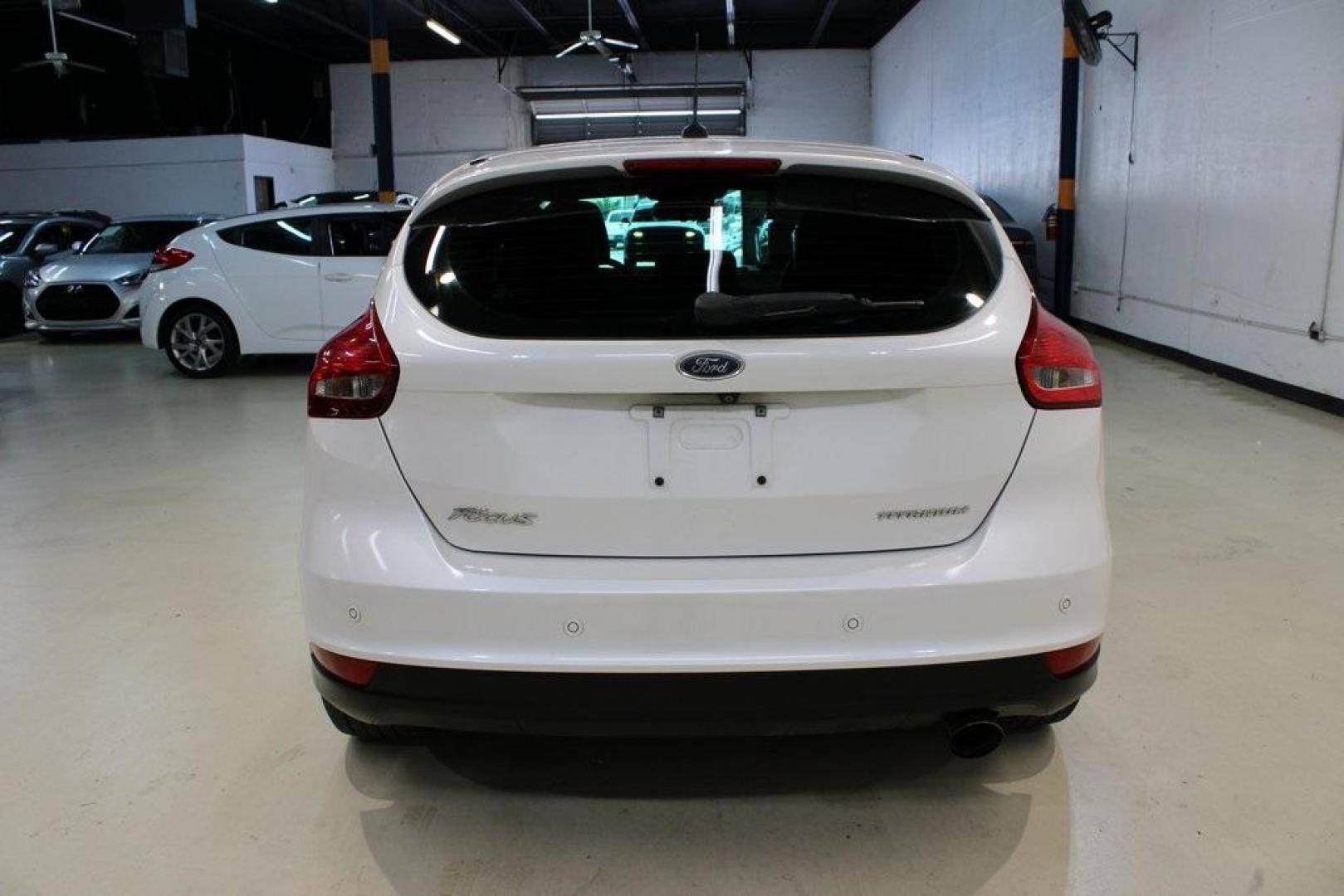 2017 White Platinum Clearcoat Metallic /Black Ford Focus Titanium (1FADP3N23HL) with an 2.0L I4 GDI Ti-VCT Flex Fuel engine, Automatic transmission, located at 15300 Midway Rd., Addison, TX, 75001, (972) 702-0011, 32.958321, -96.838074 - Photo#7