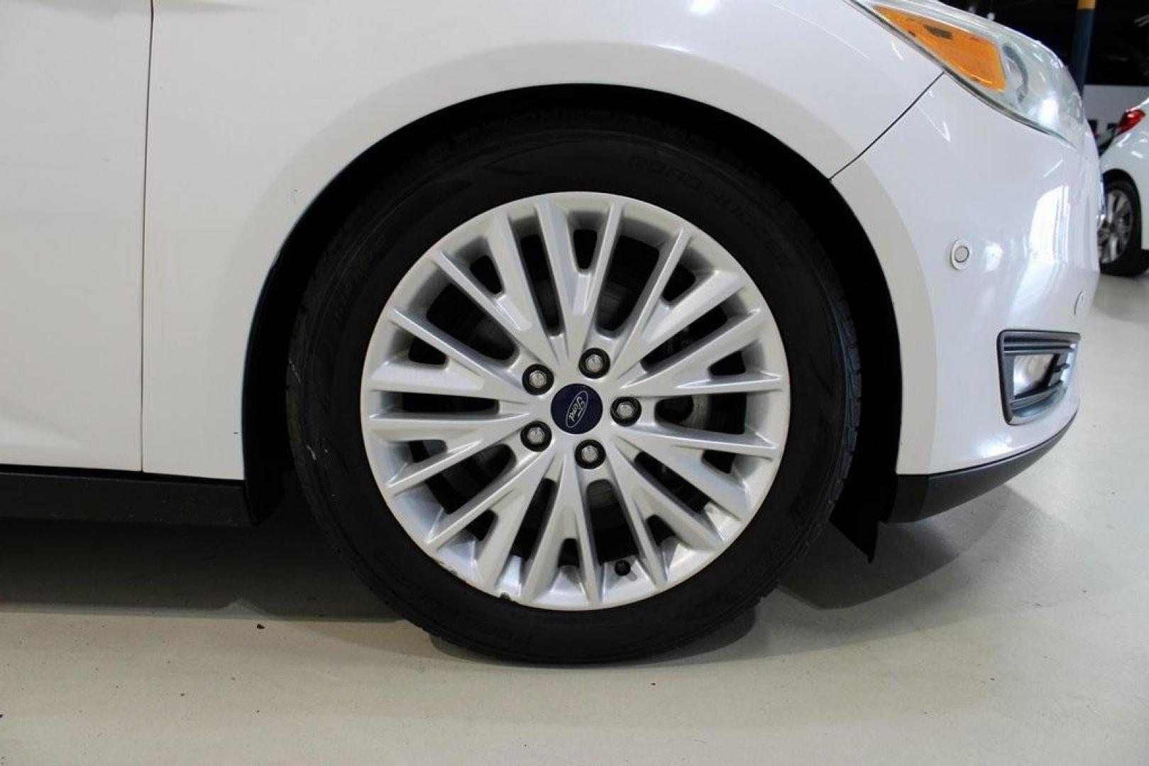 2017 White Platinum Clearcoat Metallic /Black Ford Focus Titanium (1FADP3N23HL) with an 2.0L I4 GDI Ti-VCT Flex Fuel engine, Automatic transmission, located at 15300 Midway Rd., Addison, TX, 75001, (972) 702-0011, 32.958321, -96.838074 - Photo#11