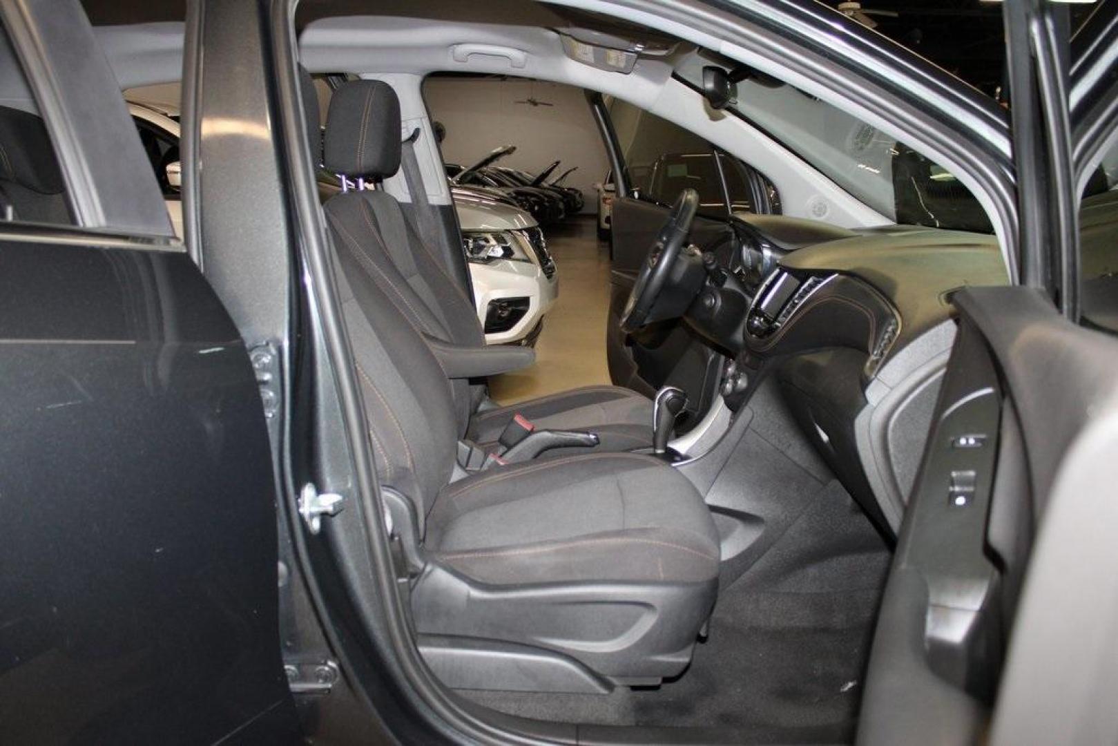 2017 Nightfall Gray Metallic /Jet Black Chevrolet Trax LT (3GNCJLSB3HL) with an ECOTEC 1.4L I4 SMPI DOHC Turbocharged VVT engine, Automatic transmission, located at 15300 Midway Rd., Addison, TX, 75001, (972) 702-0011, 32.958321, -96.838074 - 2017 Chevrolet Trax LT<br>Now Available at Midway Auto Group, Addison, Texas<br><br>Compact, versatile, and city-friendly, the 2017 Chevrolet Trax LT is designed for drivers who want SUV utility in an agile, fuel-efficient package. With its modern tech, comfortable interior, and confident performanc - Photo#13