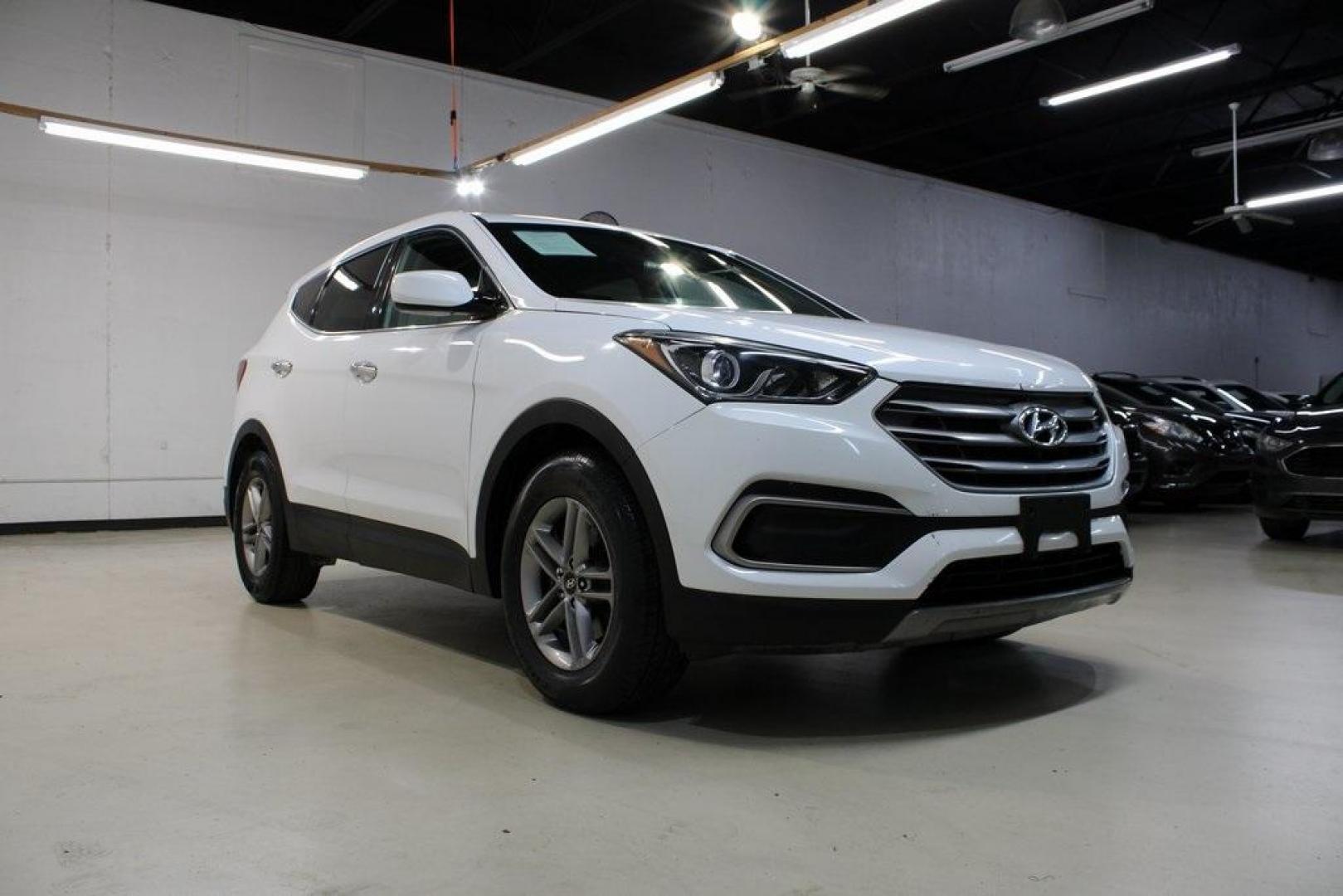 2018 Pearl White /Gray Hyundai Santa Fe Sport 2.4 Base (5XYZT3LB5JG) with an 2.4L I4 DGI DOHC 16V engine, Automatic transmission, located at 15300 Midway Rd., Addison, TX, 75001, (972) 702-0011, 32.958321, -96.838074 - 2018 Hyundai Santa Fe Sport<br>Now Available at Midway Auto Group Addison, Texas<br><br>Spacious, stylish, and versatile, the 2018 Hyundai Santa Fe Sport is a midsize SUV designed to handle daily commutes, weekend getaways, and everything in between. With a comfortable cabin, modern technology, and - Photo#1